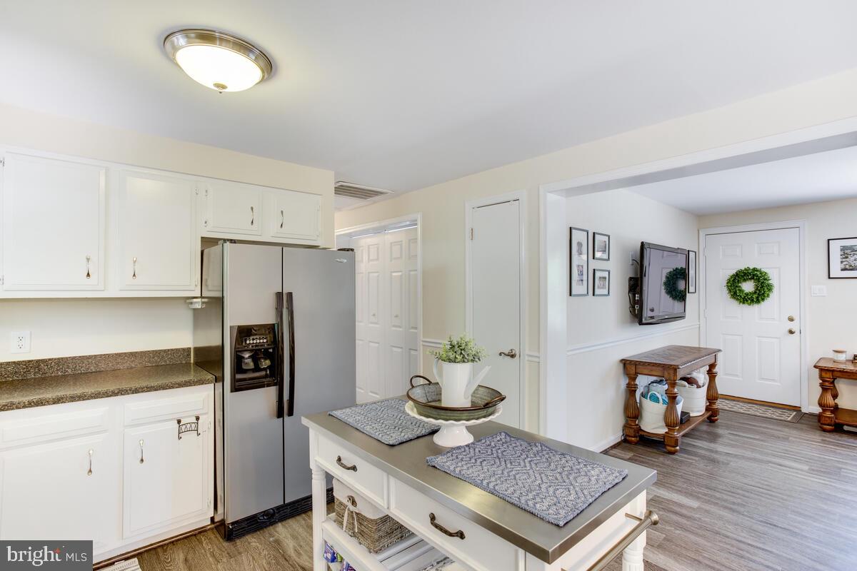 1260 Coster Road Lusby, MD 20657 - Photo 15 of 46 a kitchen with refrigerator and window