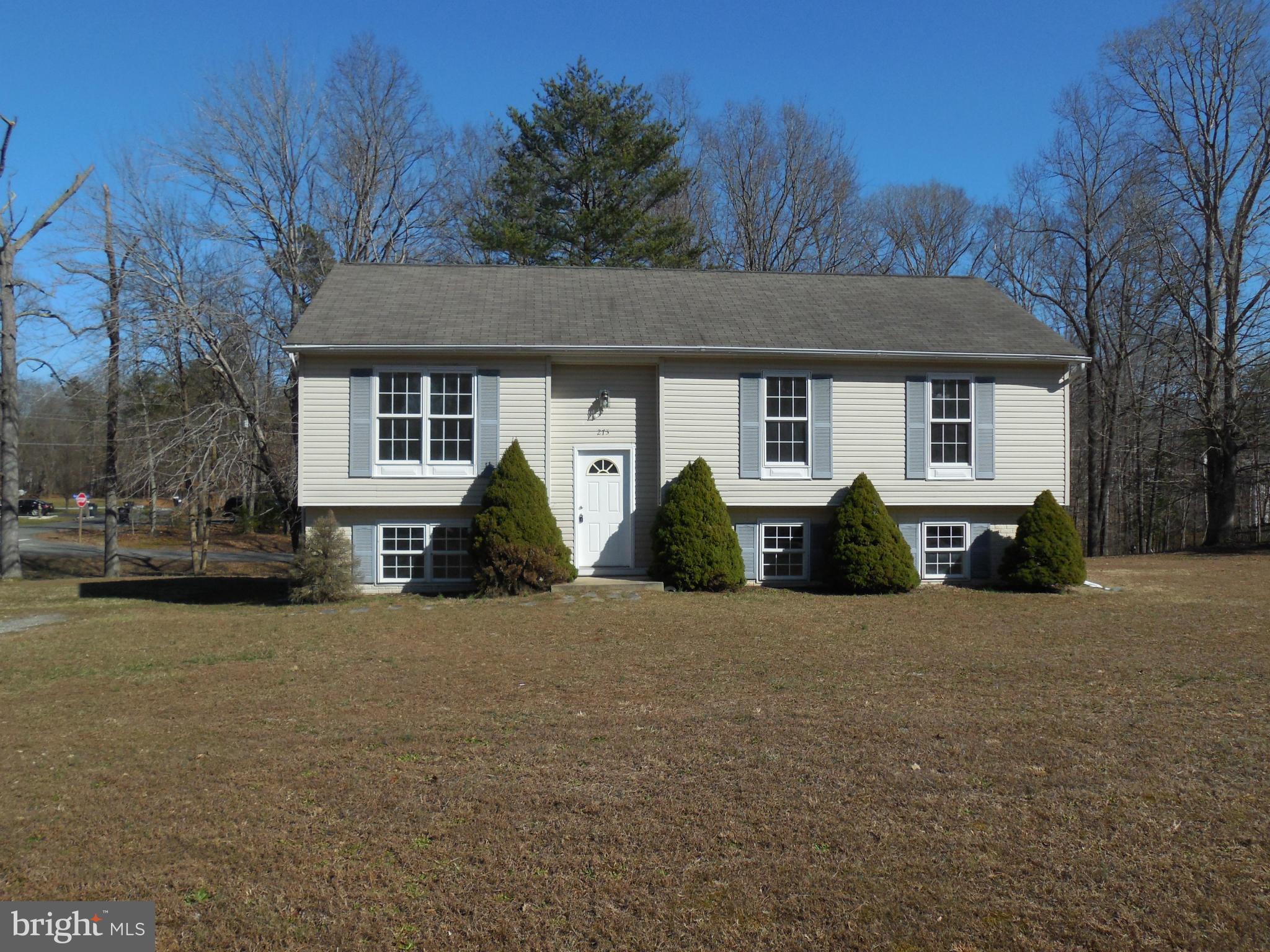 275 Cedar Ridge Drive Ruther Glen, VA 22546 - Photo 1 of 25 a front view of a house with garden