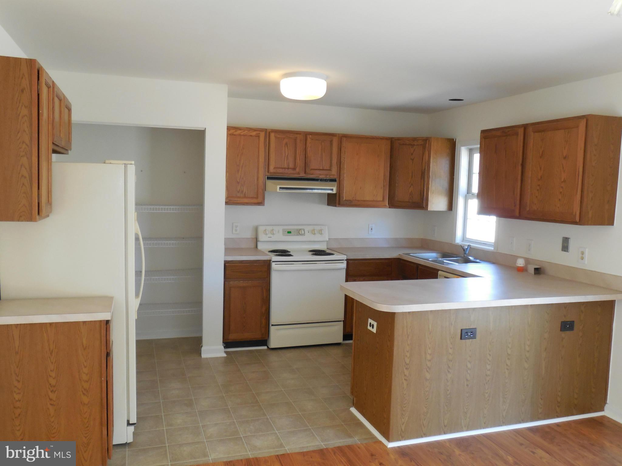275 Cedar Ridge Drive Ruther Glen, VA 22546 - Photo 11 of 25 a kitchen with a sink appliances and cabinets