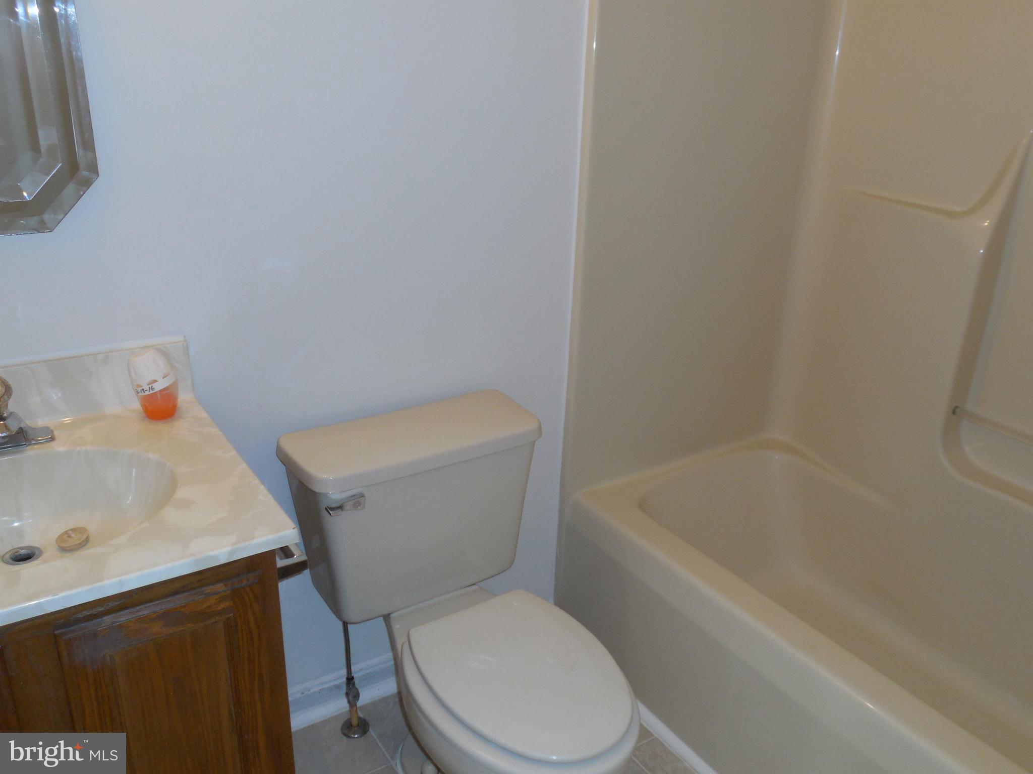 275 Cedar Ridge Drive Ruther Glen, VA 22546 - Photo 14 of 25 a white toilet sitting next to a bath tub