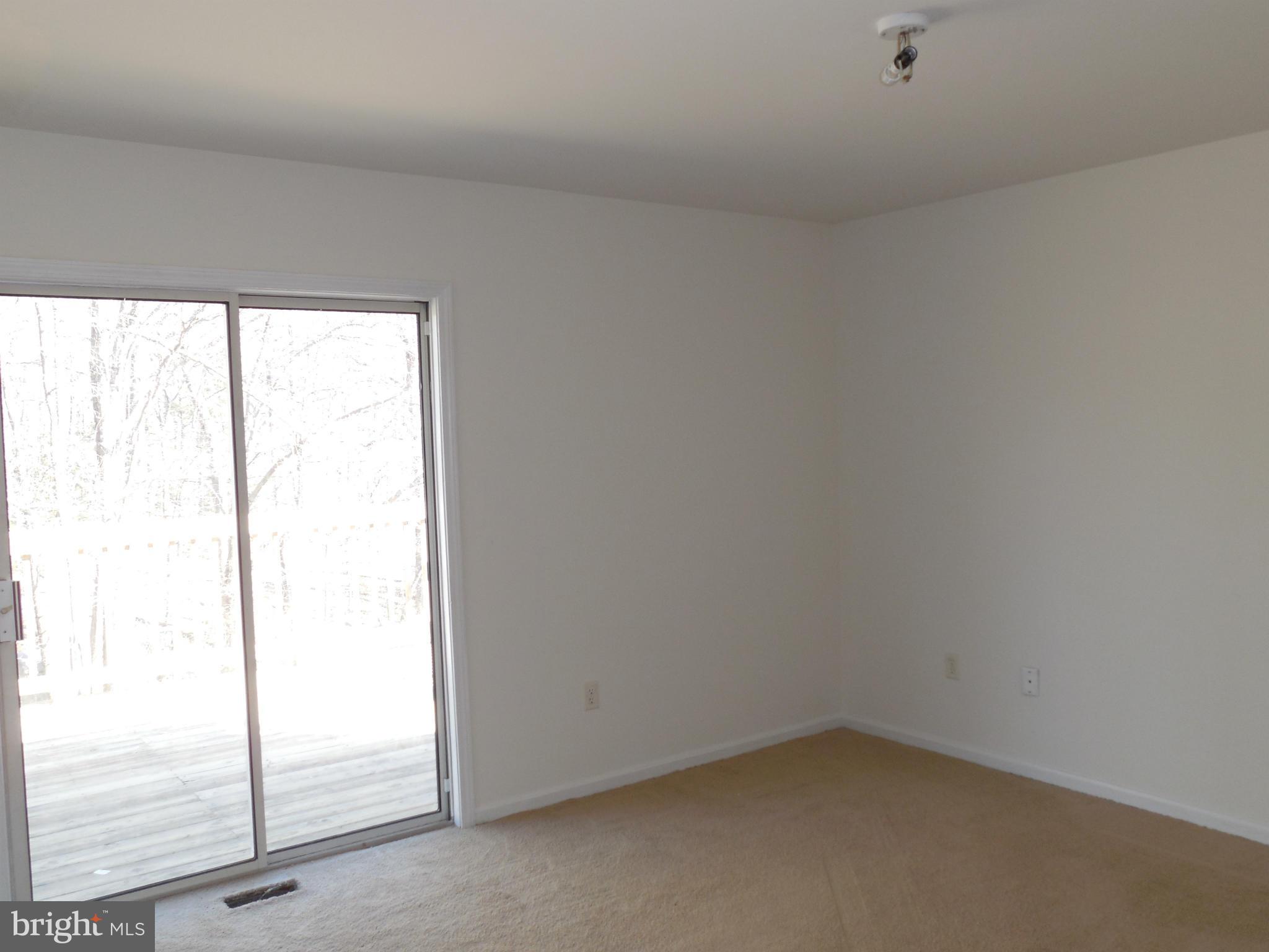 275 Cedar Ridge Drive Ruther Glen, VA 22546 - Photo 18 of 25 an empty room with a window