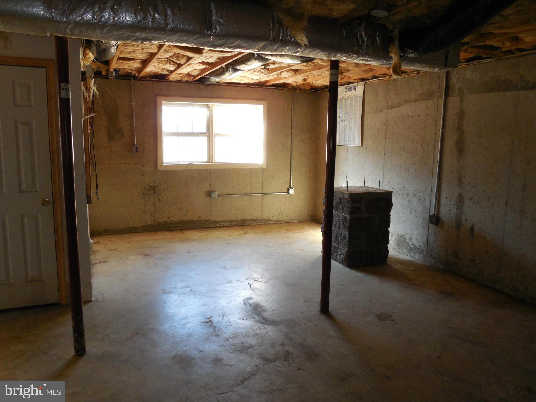275 Cedar Ridge Drive Ruther Glen, VA 22546 - Photo 21 of 25 a view of empty room with wooden floor and windows