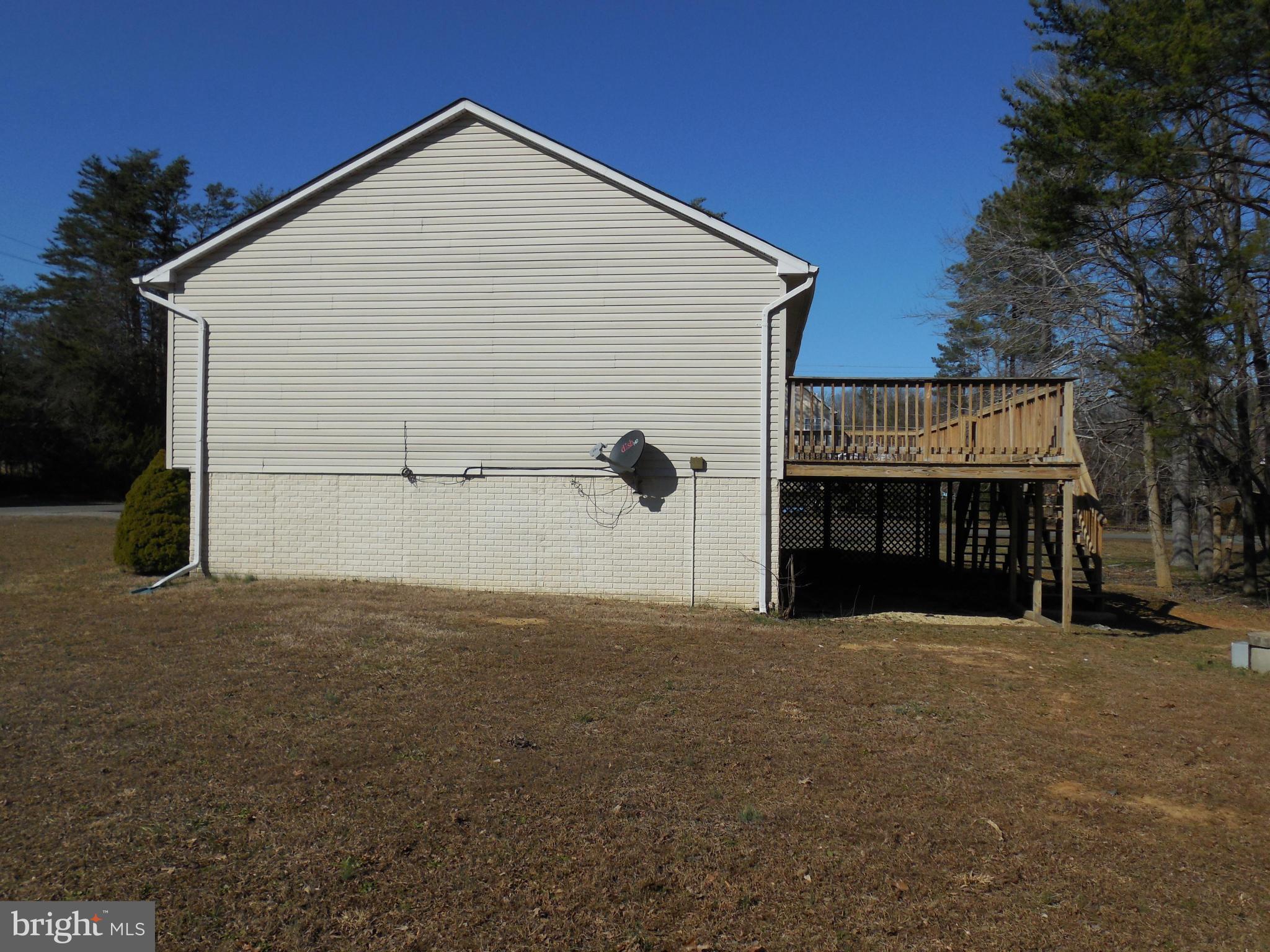 275 Cedar Ridge Drive Ruther Glen, VA 22546 - Photo 7 of 25 a view of a house with a yard
