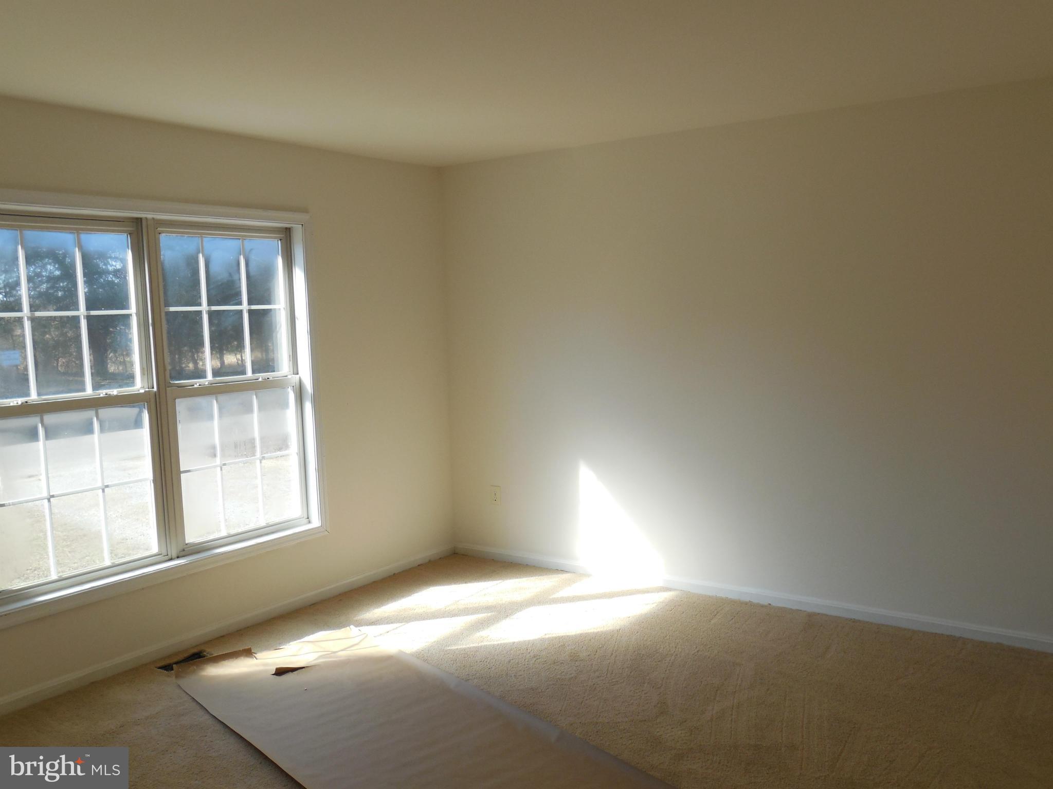 275 Cedar Ridge Drive Ruther Glen, VA 22546 - Photo 9 of 25 a view of an empty room and a window