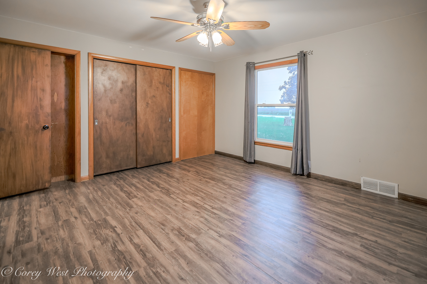 8994 Highway 64 Sycamore, IL 60178 - Photo 16 of 37 wooden floor in an empty room with a window
