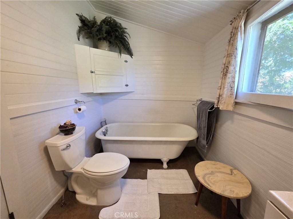 1414 Marin Street Corning, CA 96021 - Photo 13 of 43 a white toilet sitting next to a bathroom sink