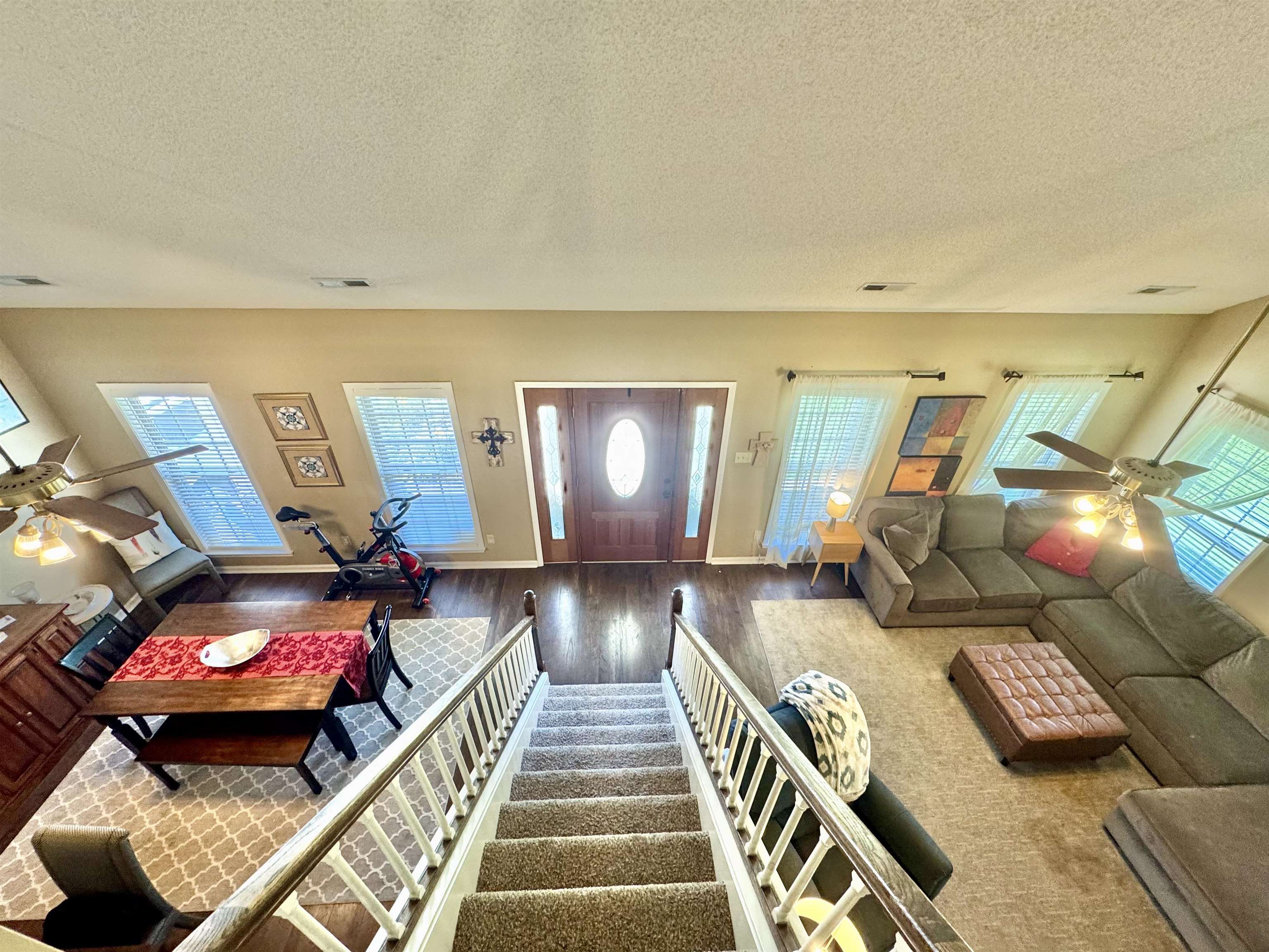 150 Westwood Circle Ripley, TN 38063 - Photo 14 of 28 Living room featuring ceiling fan, wood finished floors, a textured ceiling, plenty of natural light, and baseboards