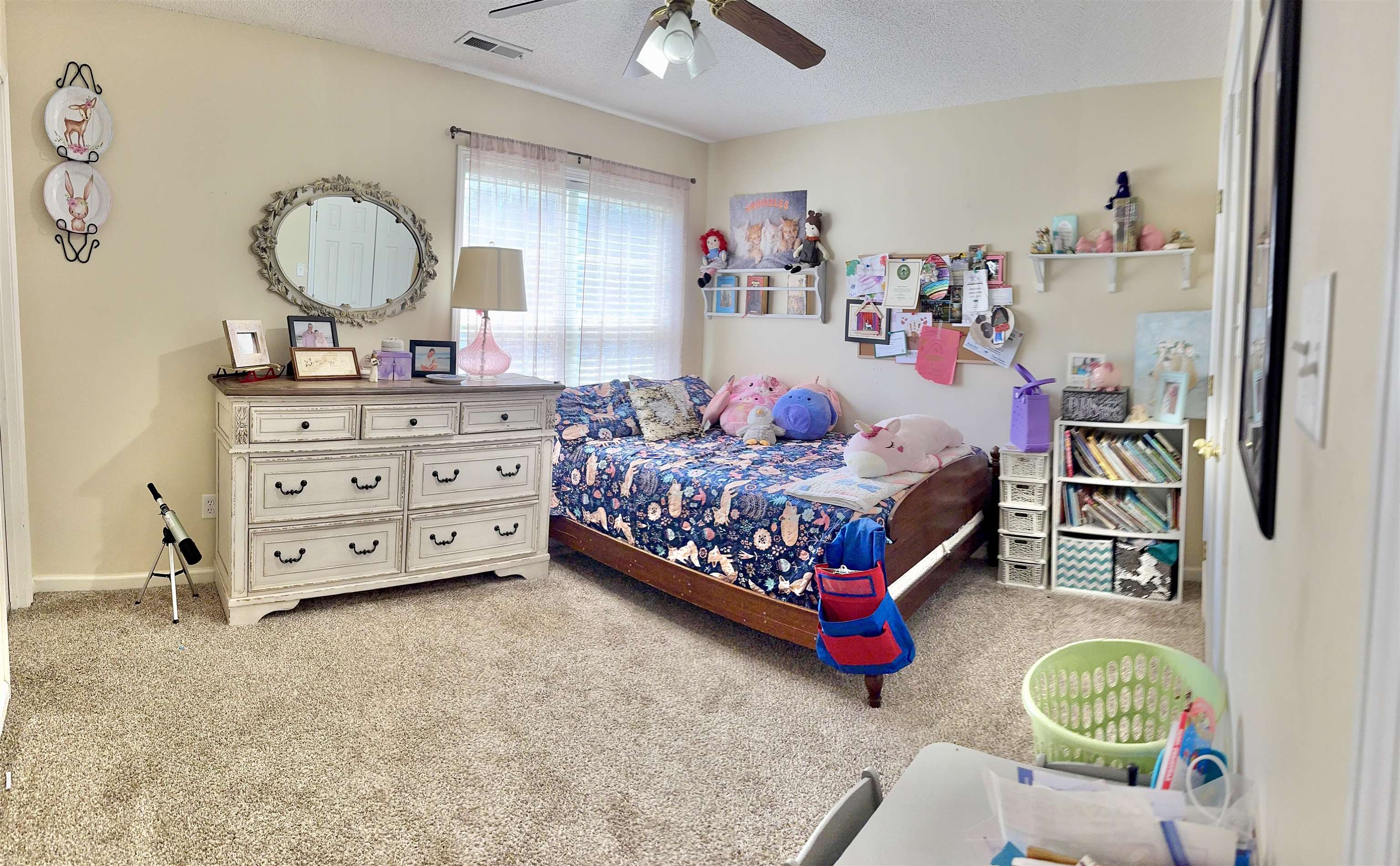 150 Westwood Circle Ripley, TN 38063 - Photo 17 of 28 Bedroom featuring carpet floors, a ceiling fan, and a textured ceiling