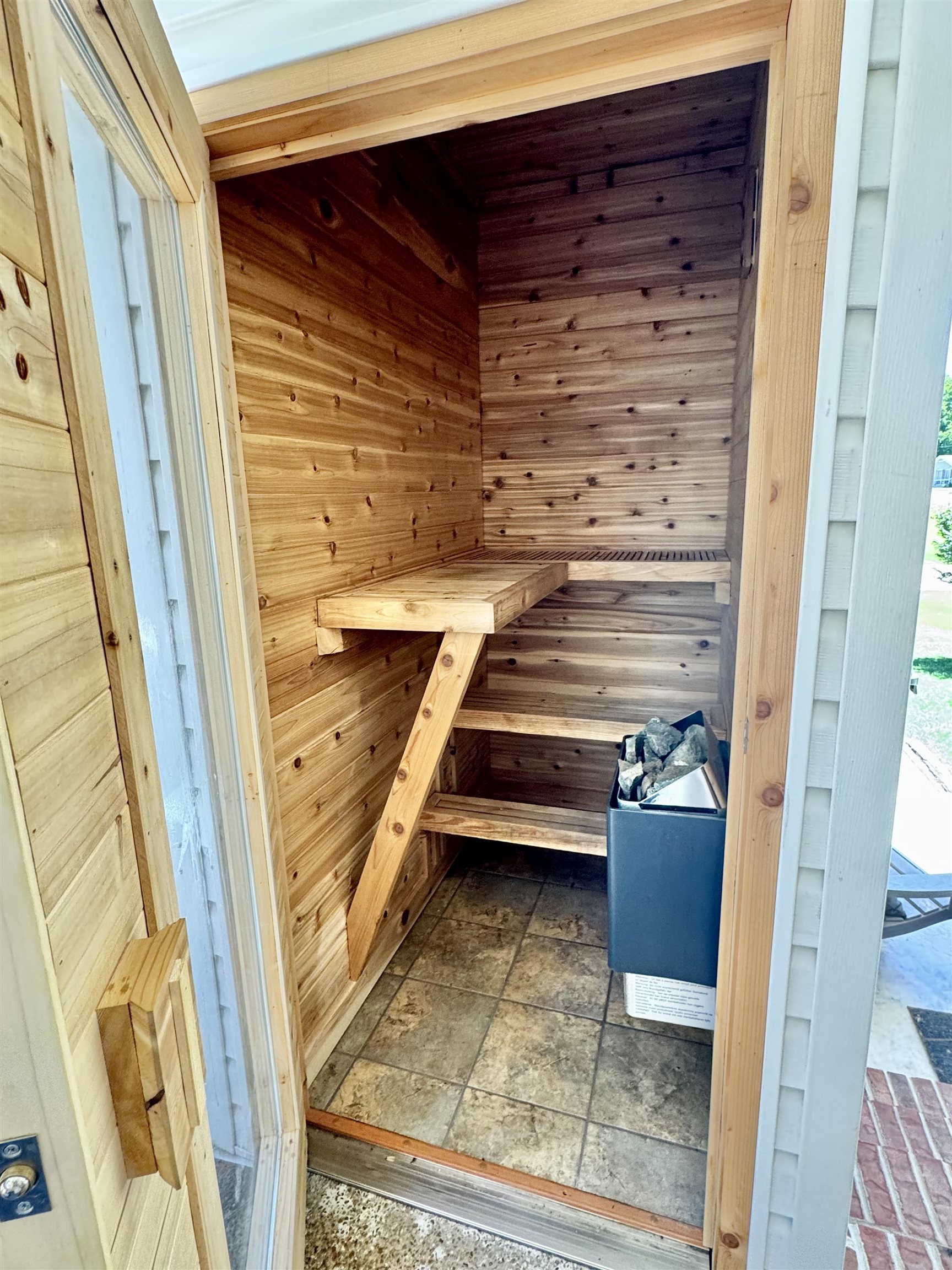 150 Westwood Circle Ripley, TN 38063 - Photo 20 of 28 Relaxing sauna featuring wood walls and stone finish floors