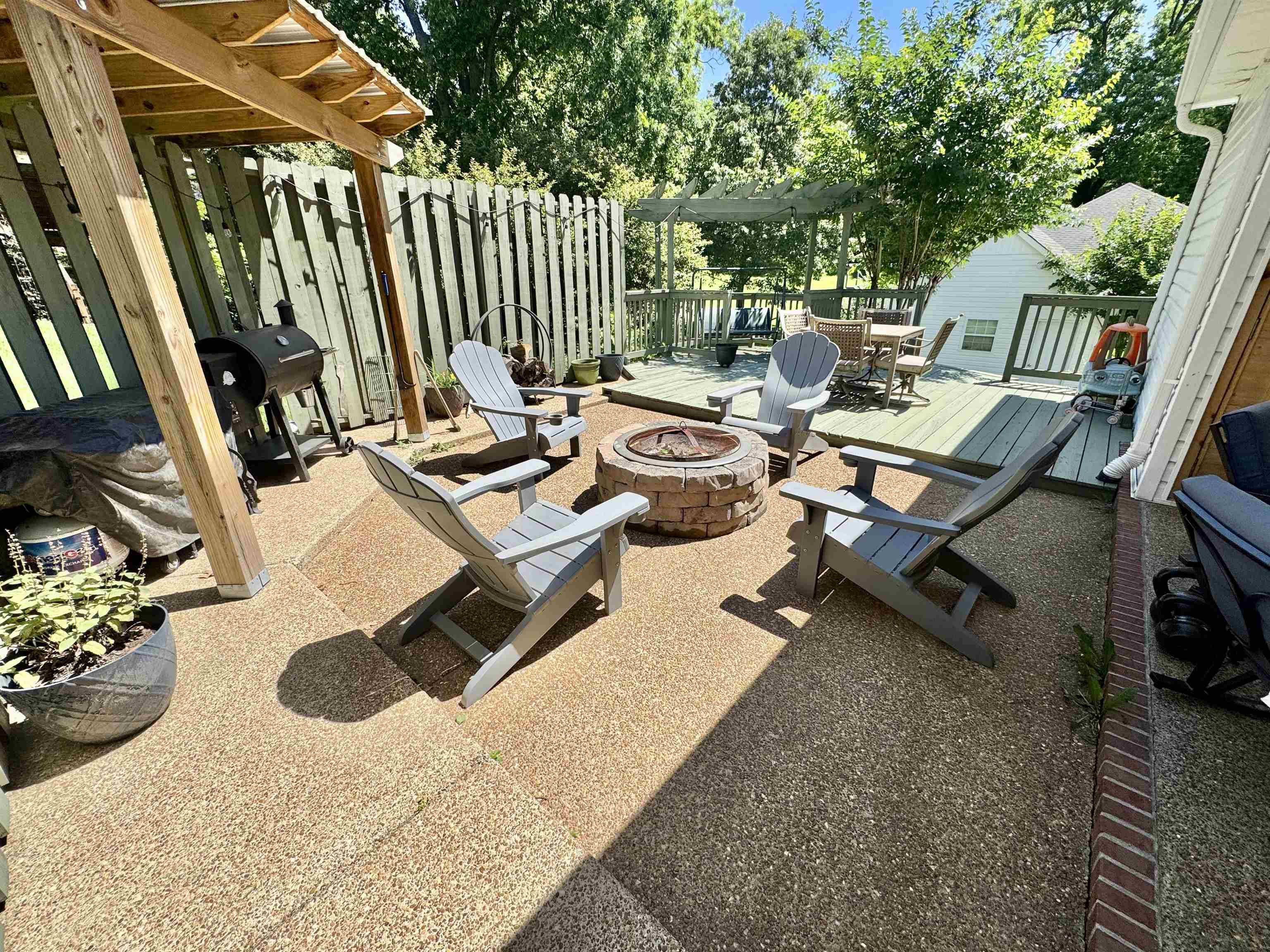 150 Westwood Circle Ripley, TN 38063 - Photo 22 of 28 View of patio with a fire pit, a wooden deck, and grilling area