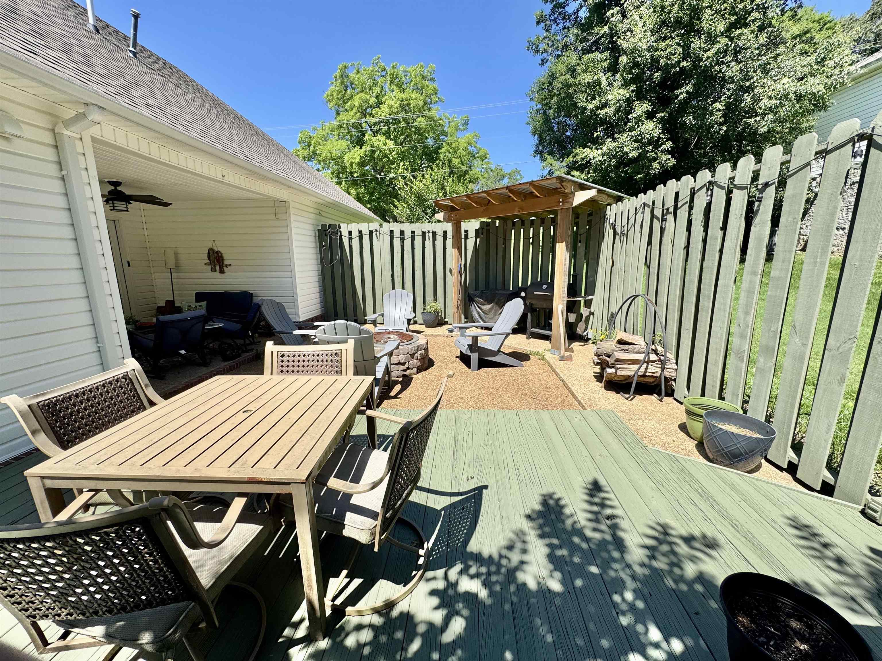 150 Westwood Circle Ripley, TN 38063 - Photo 23 of 28 Wooden deck featuring outdoor dining area and an outdoor fire pit