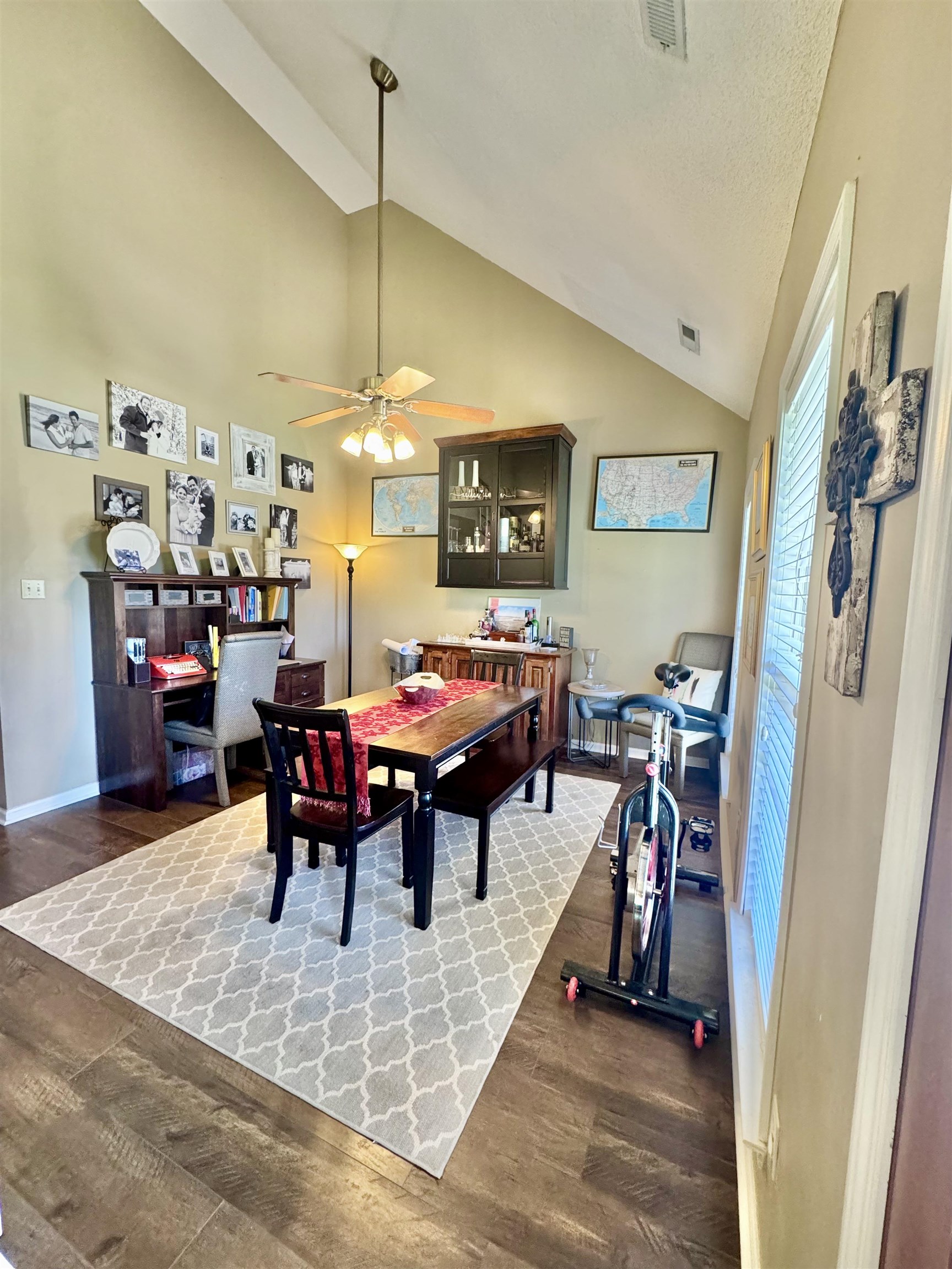 150 Westwood Circle Ripley, TN 38063 - Photo 9 of 28 Dining room featuring wood finished floors, ceiling fan, baseboards, and high vaulted ceiling