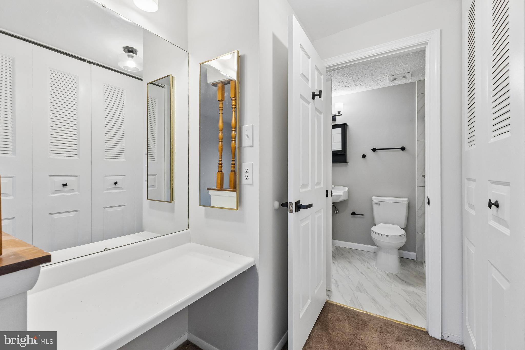 8317 Brookvale Court Springfield, VA 22153 - Photo 22 of 33 a bathroom with a sink toilet and shower