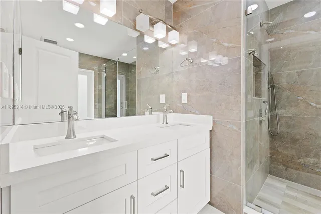 a bathroom with a shower and a sink