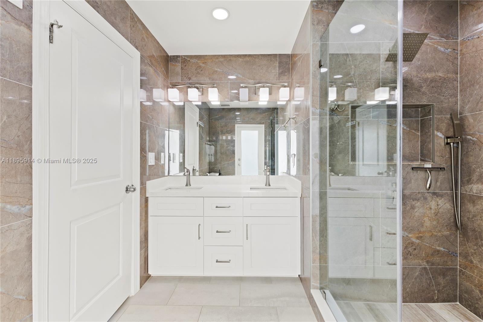 6150 Southwest 7th Street Plantation, FL 33317 - Photo 24 of 50 a bathroom with a shower and a sink