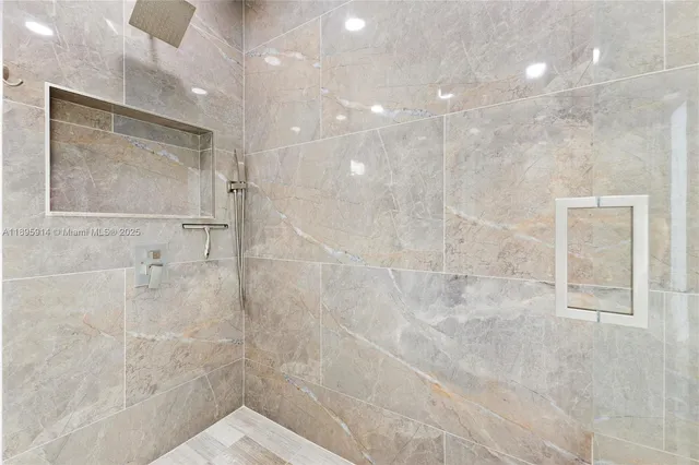 a bathroom with a sink vanity and mirror