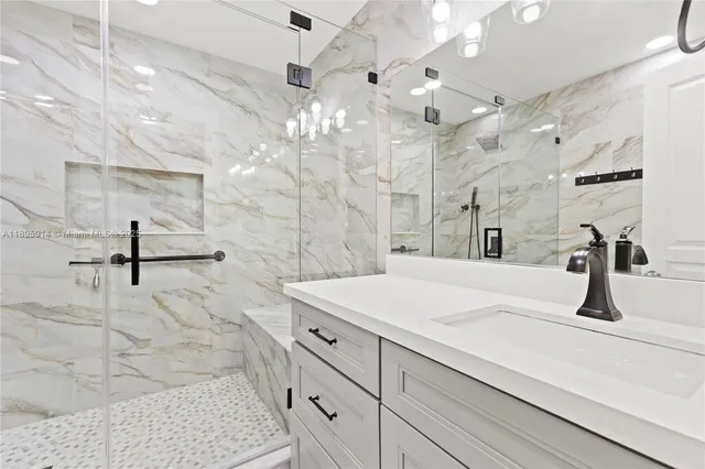 a view of an empty room with closet and wooden floor