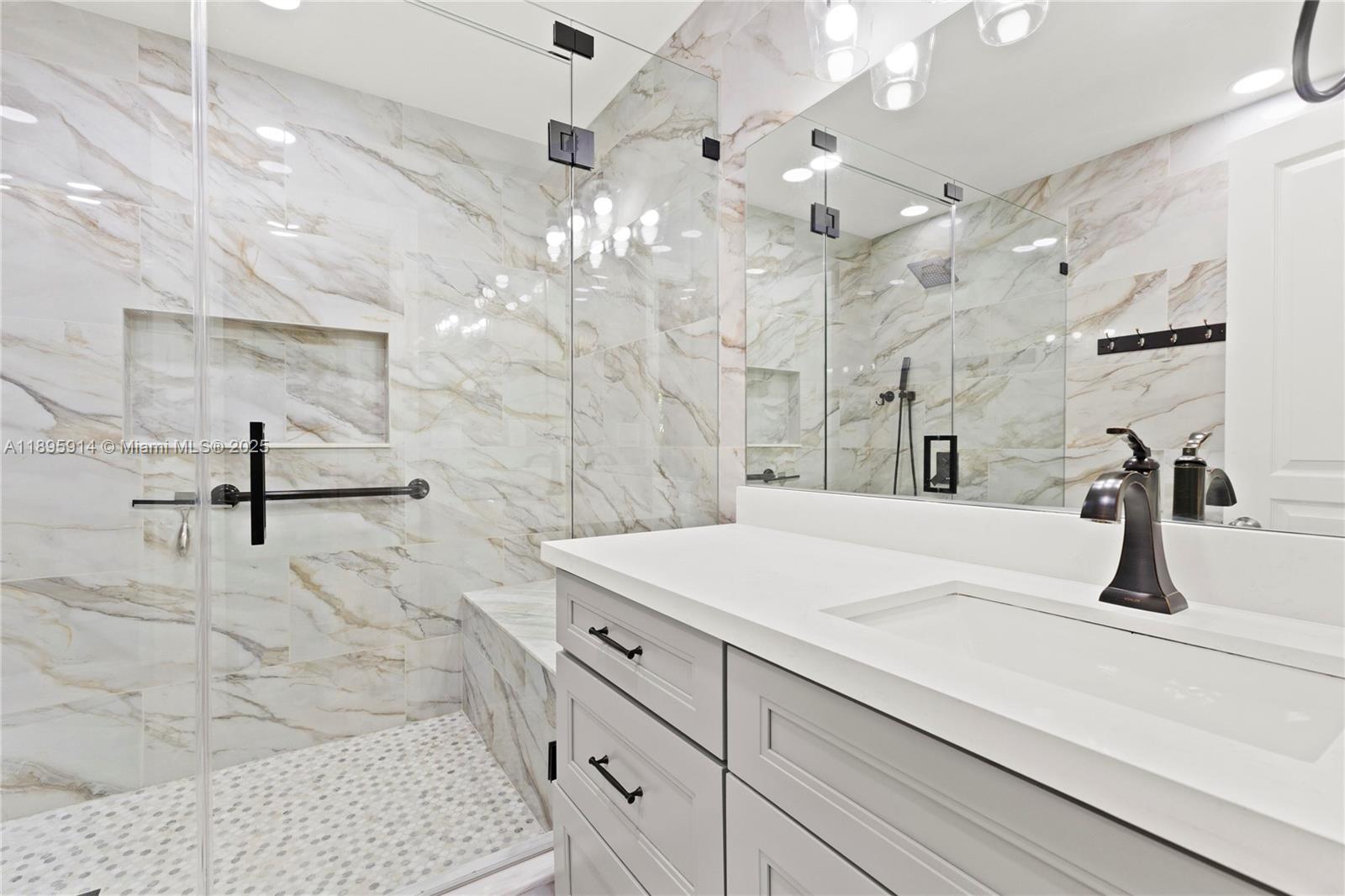 6150 Southwest 7th Street Plantation, FL 33317 - Photo 26 of 50 a bathroom with a sink vanity and mirror