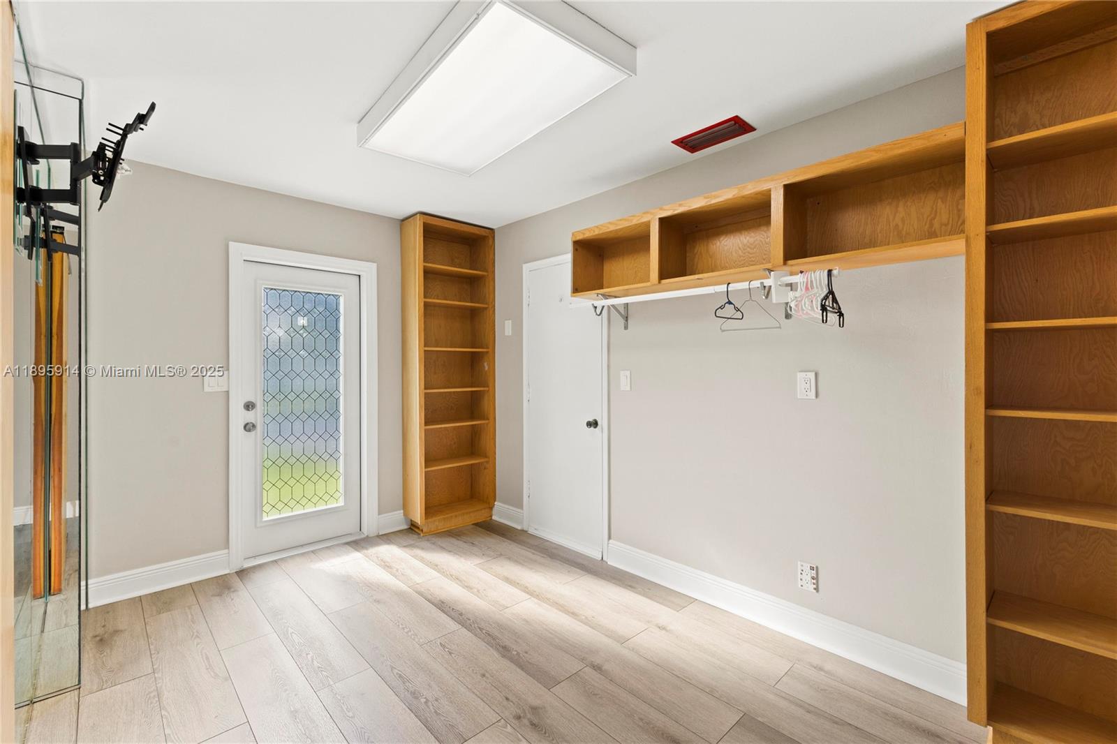 6150 Southwest 7th Street Plantation, FL 33317 - Photo 27 of 50 a view of an empty room with closet and wooden floor