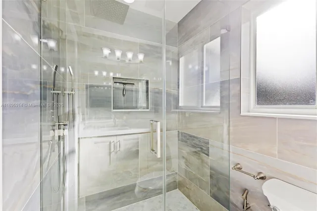 a bathroom with a sink and mirror