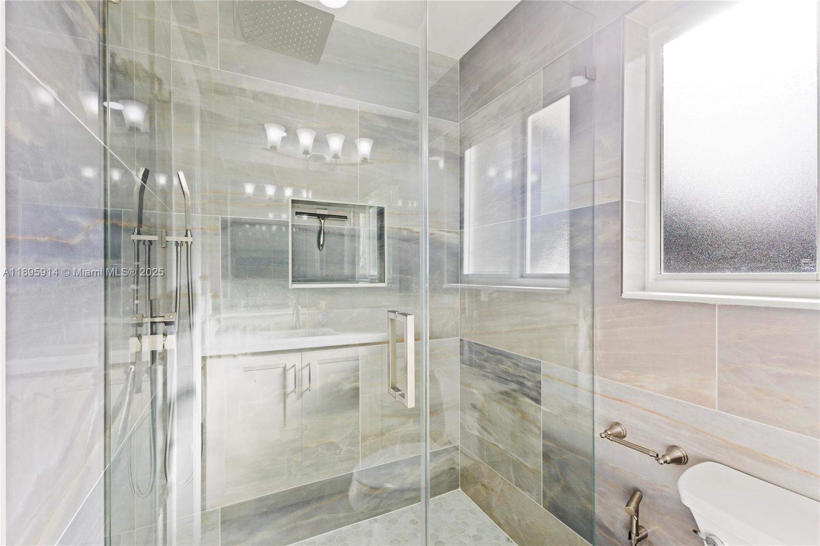 6150 Southwest 7th Street Plantation, FL 33317 - Photo 28 of 50 a bathroom with a glass shower door