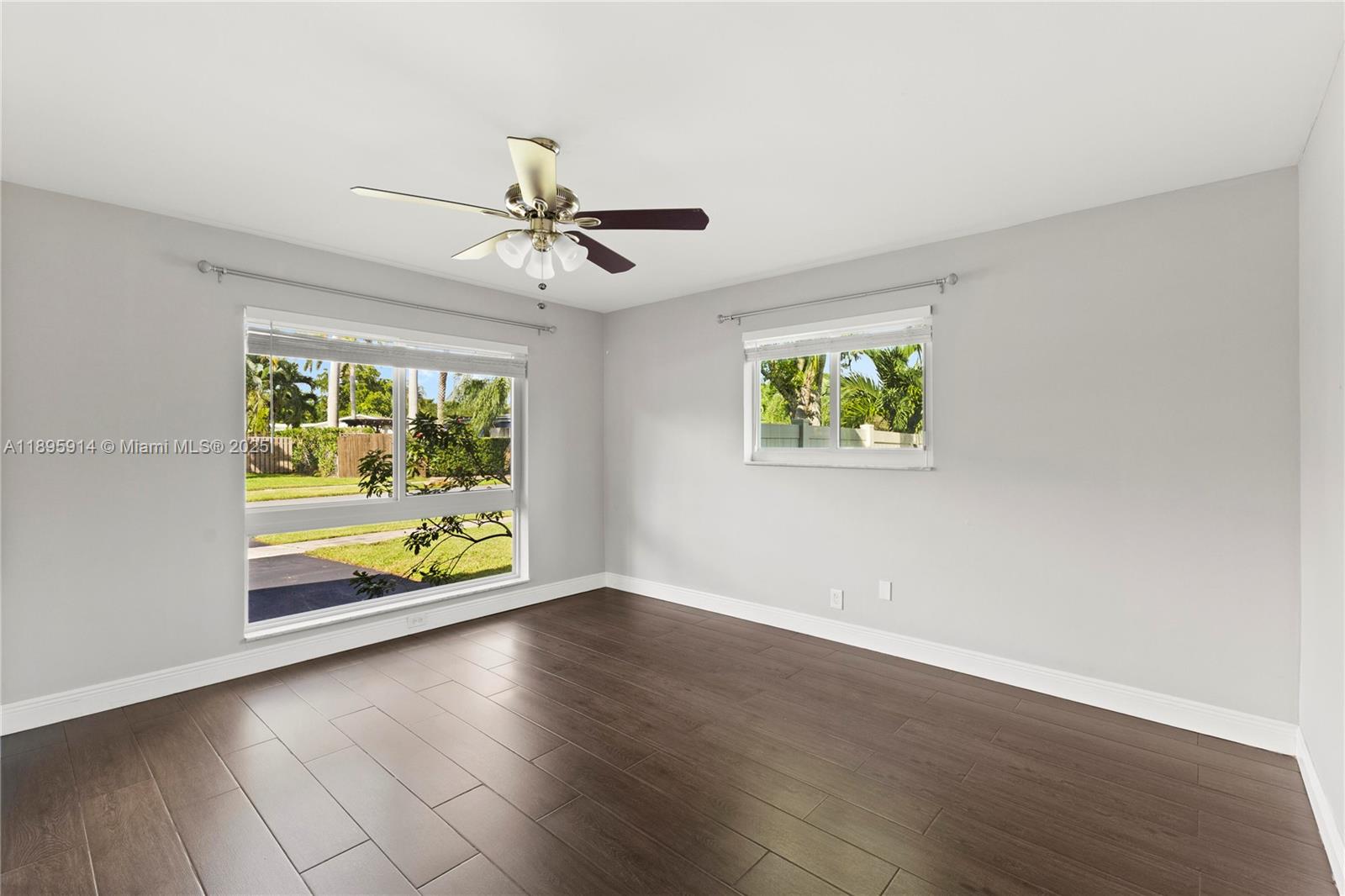 6150 Southwest 7th Street Plantation, FL 33317 - Photo 33 of 50 a view of an empty room with wooden floor and a window