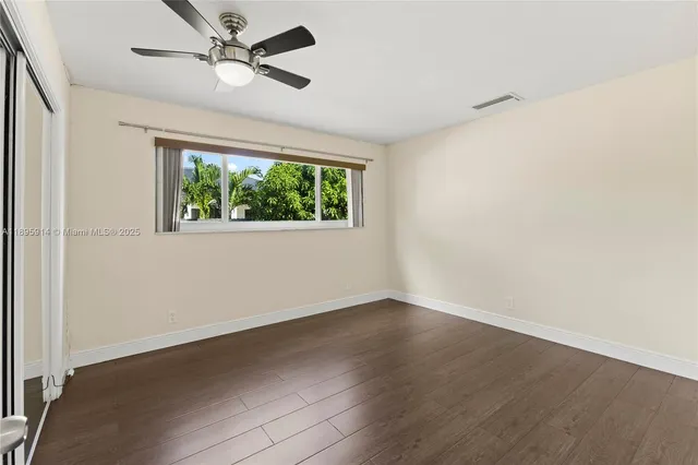 a view of a living room with a large window