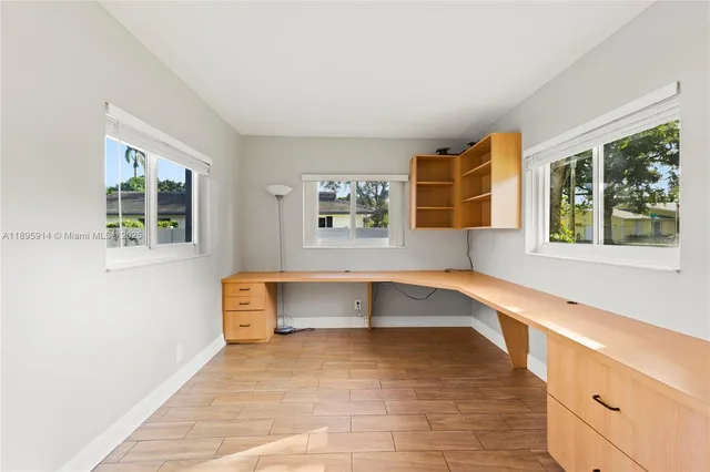 a view of room with window and cabinet