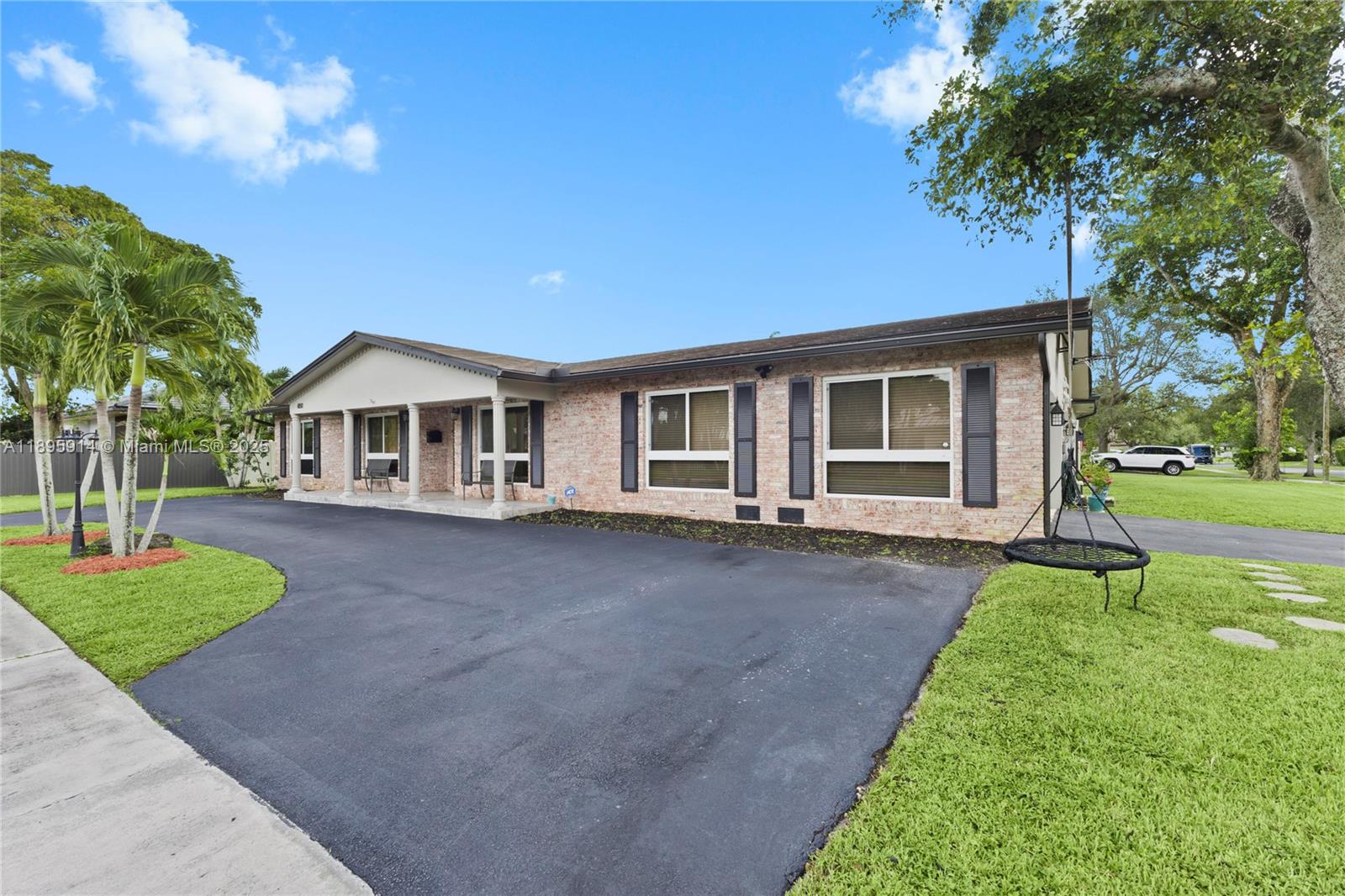 6150 Southwest 7th Street Plantation, FL 33317 - Photo 4 of 50 a view of a house with a yard and tree s