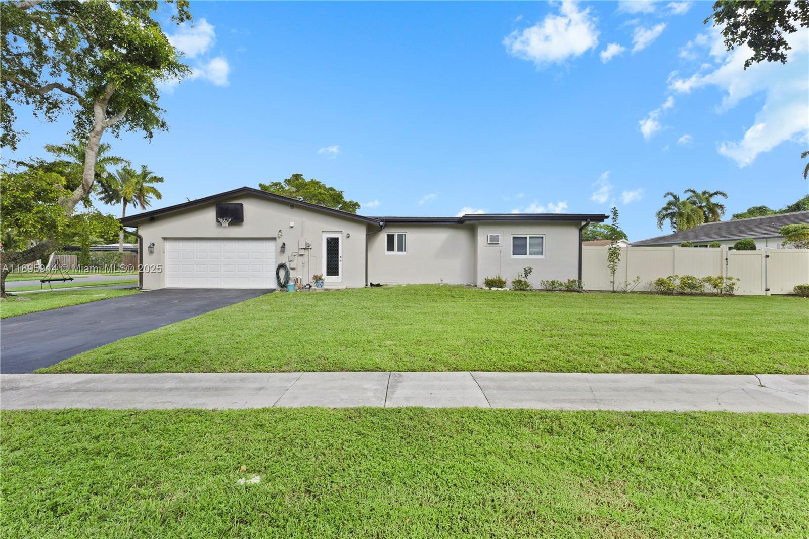 6150 Southwest 7th Street Plantation, FL 33317 - Photo 46 of 50 a view of a house with a big yard and large trees