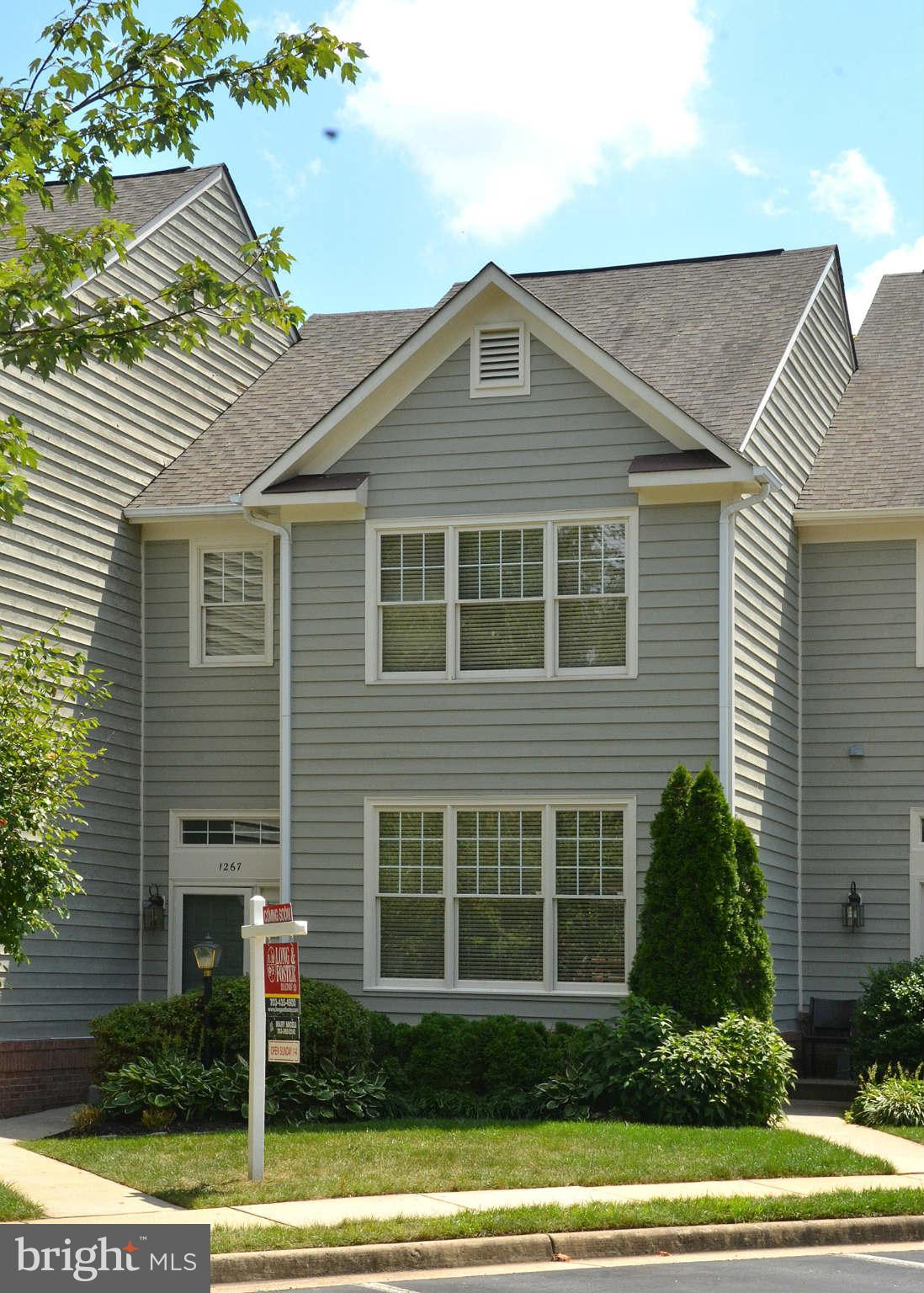 1267 Weatherstone Court Reston, VA 20194 - Photo 1 of 30 a front view of a house with a yard