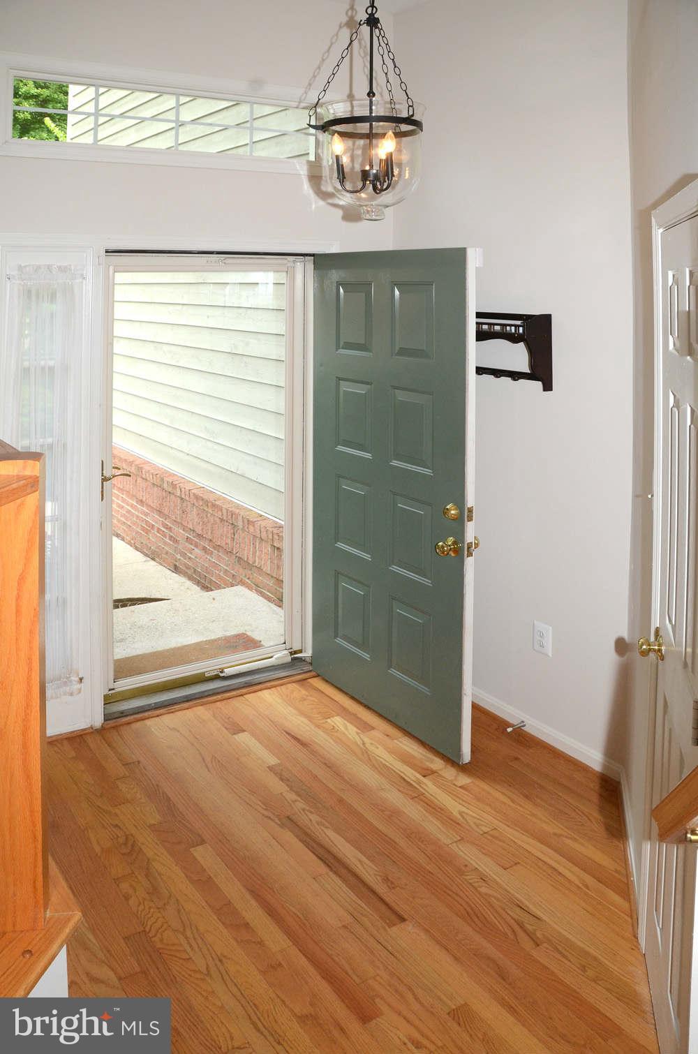 1267 Weatherstone Court Reston, VA 20194 - Photo 2 of 30 a view of empty room with wooden floor and fan