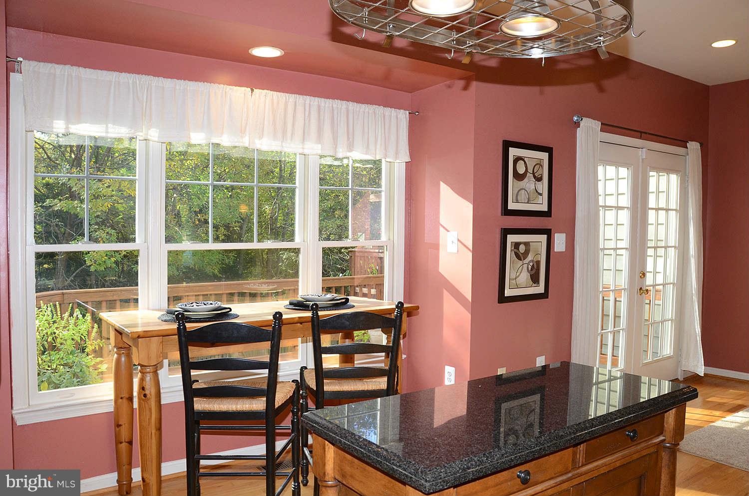 1267 Weatherstone Court Reston, VA 20194 - Photo 11 of 30 a view of a dining room with furniture window and outside view