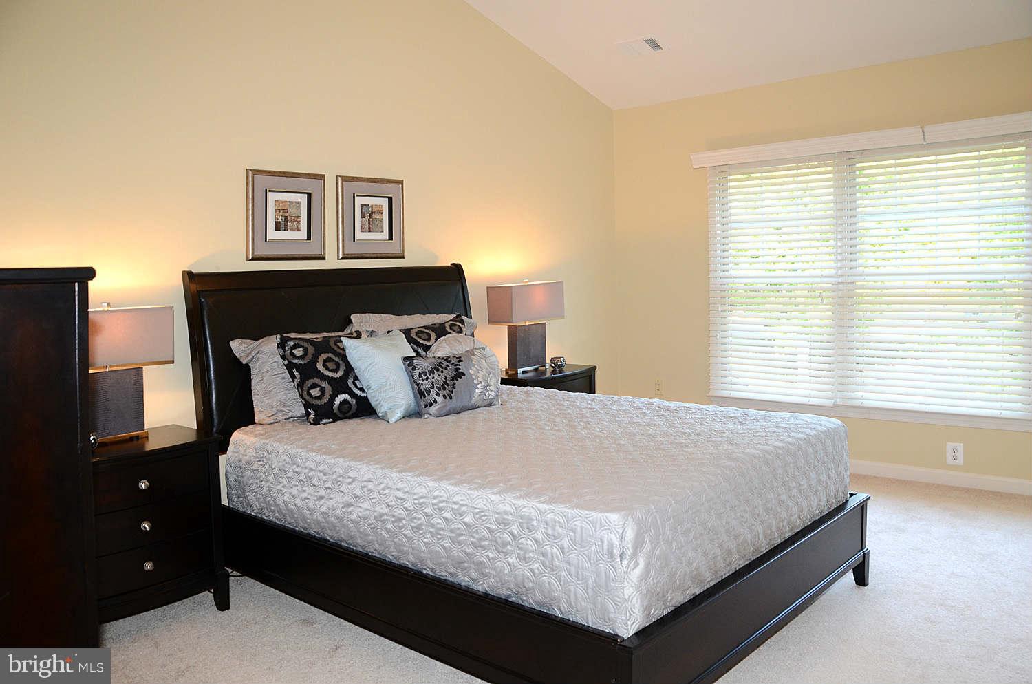 1267 Weatherstone Court Reston, VA 20194 - Photo 14 of 30 a bedroom with a bed and window