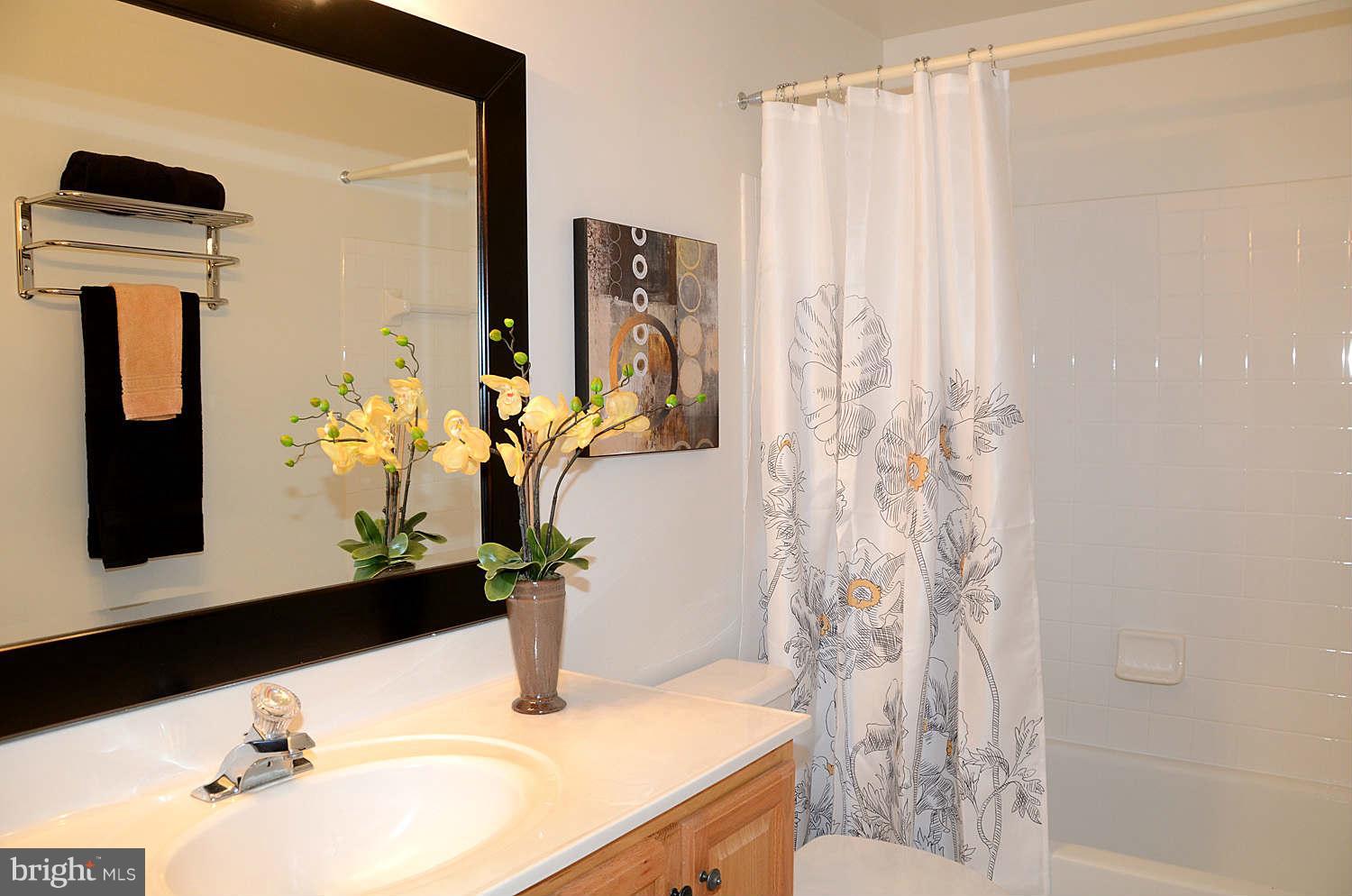 1267 Weatherstone Court Reston, VA 20194 - Photo 21 of 30 a bathroom with a sink toilet and mirror