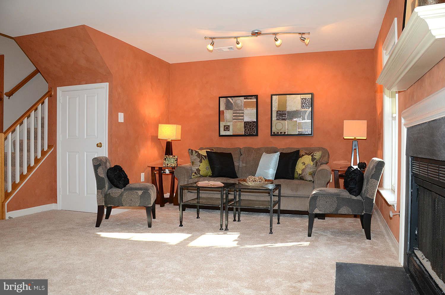 1267 Weatherstone Court Reston, VA 20194 - Photo 25 of 30 a living room with furniture and a flat screen tv
