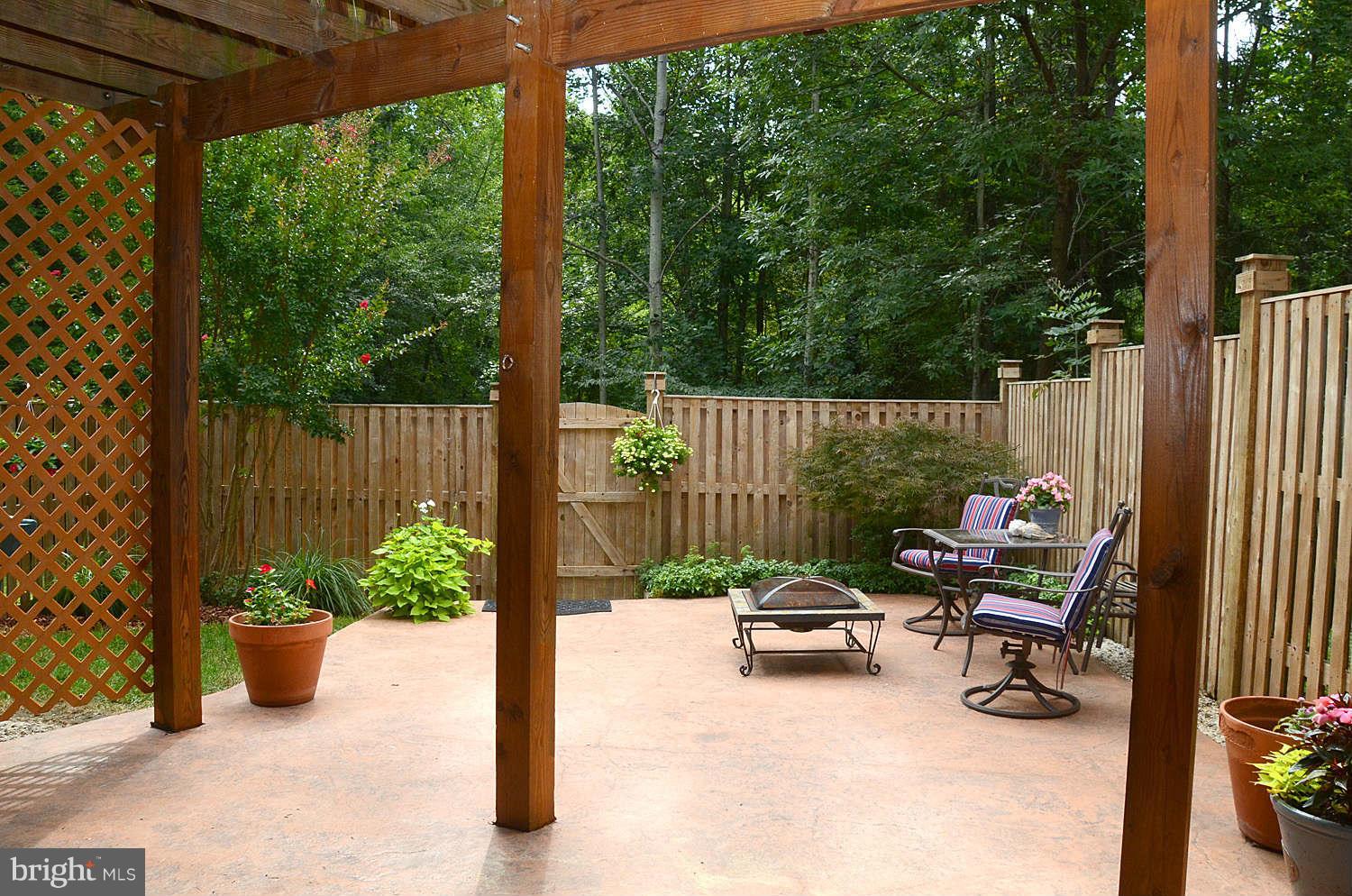 1267 Weatherstone Court Reston, VA 20194 - Photo 28 of 30 a view of a patio with a table and chairs