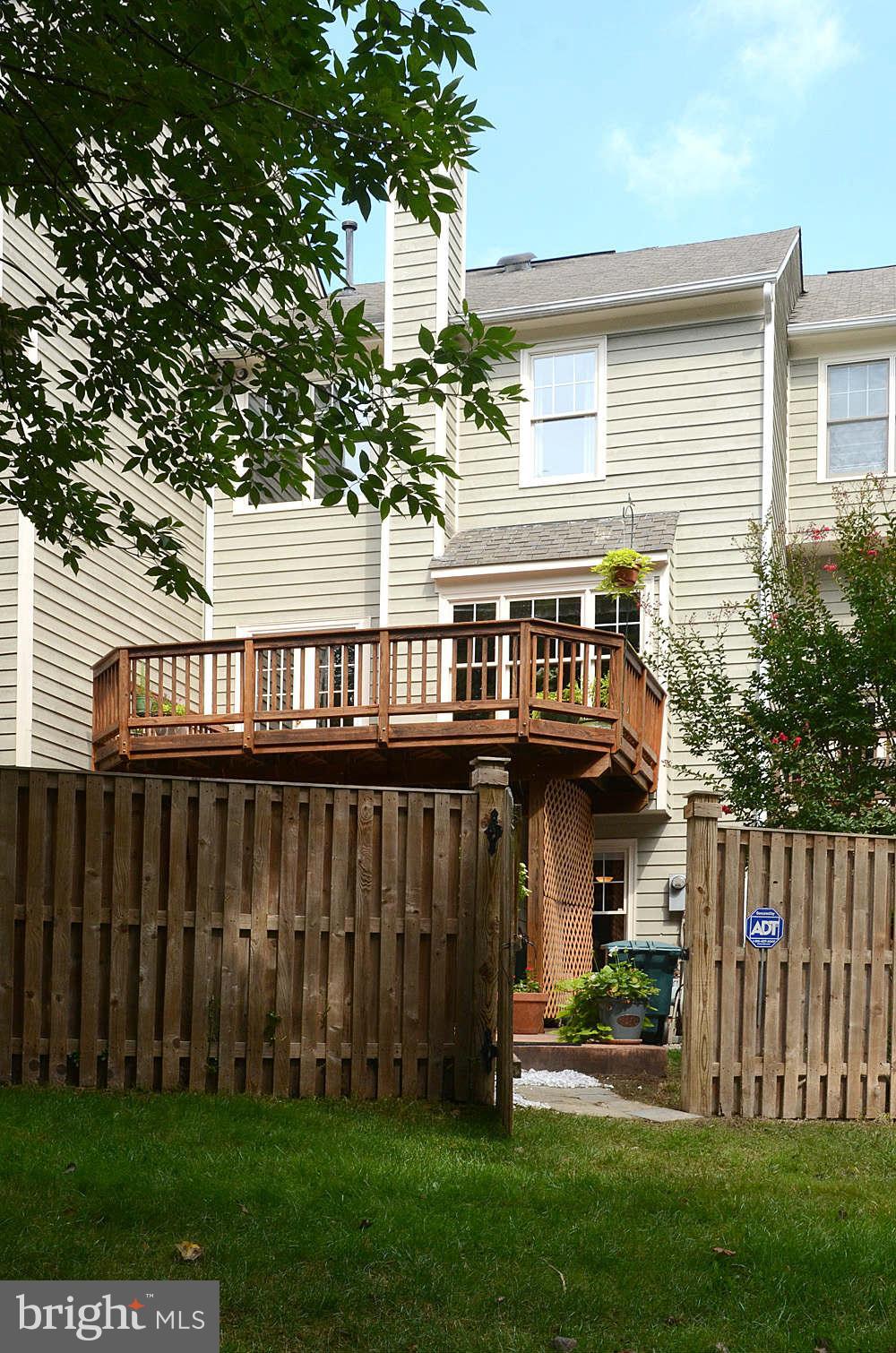1267 Weatherstone Court Reston, VA 20194 - Photo 30 of 30 a view of a house with a yard and plants