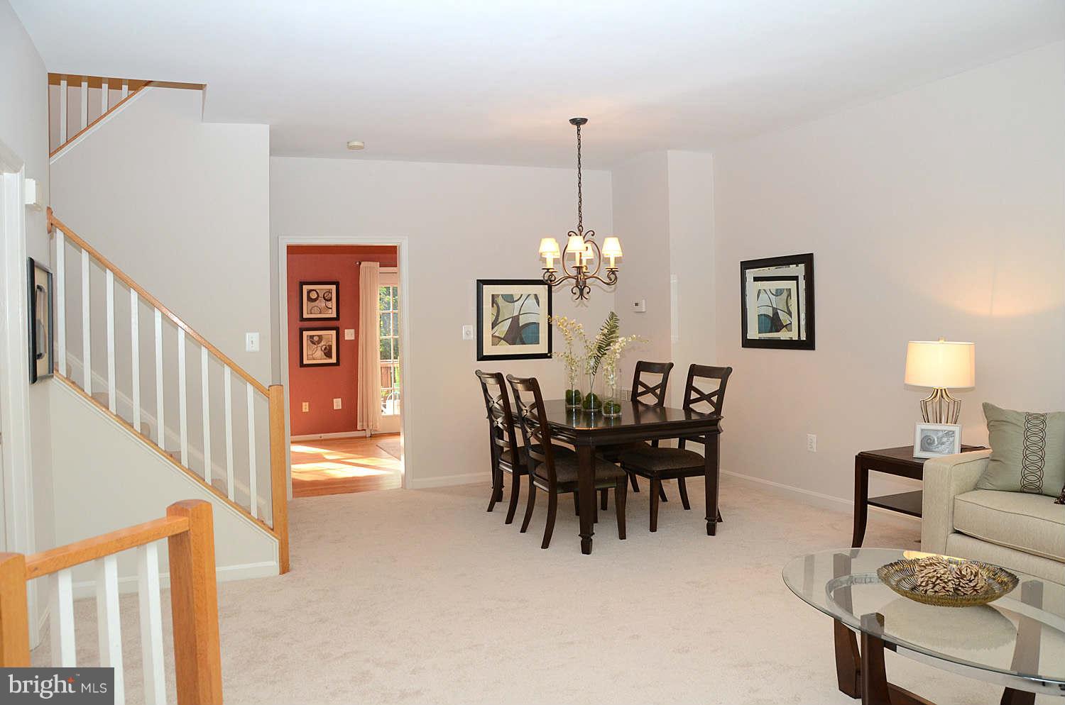 1267 Weatherstone Court Reston, VA 20194 - Photo 4 of 30 a view of a dining room with furniture