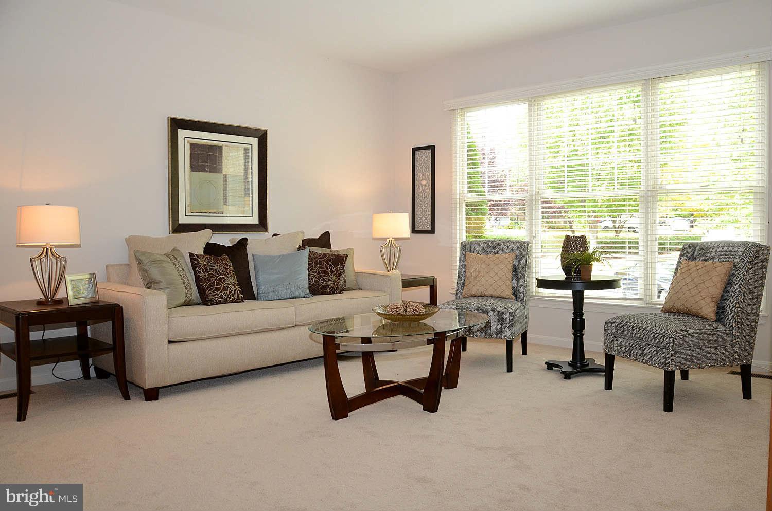 1267 Weatherstone Court Reston, VA 20194 - Photo 5 of 30 a living room with furniture and a lamp