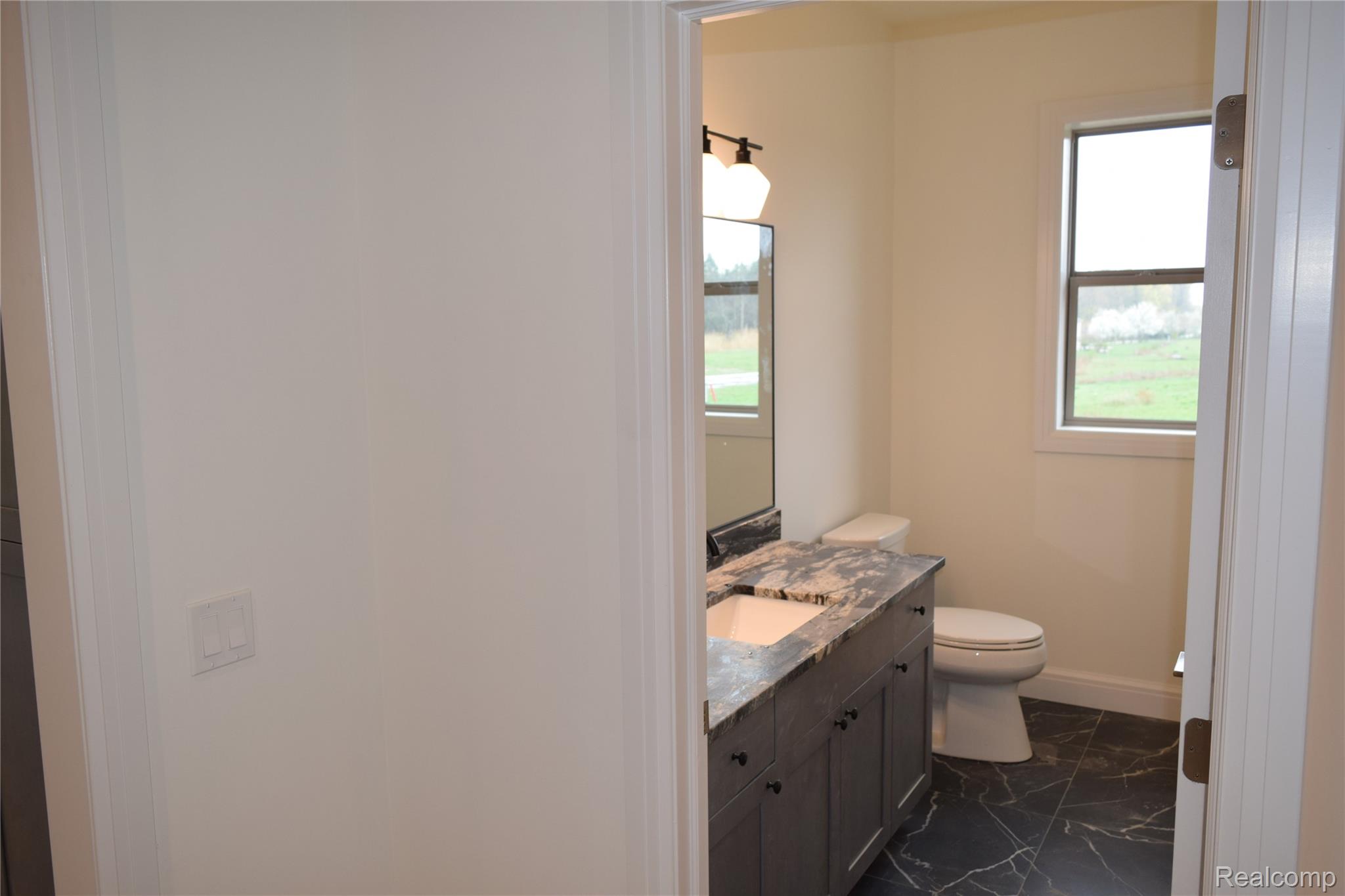 3093 Raffler Drive Rochester, MI 48307 - Photo 22 of 34 Powder Rm bathroom