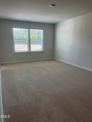a bathroom with a double vanity sink and mirror