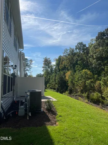 a view of a patio with table and chairs and potted plants