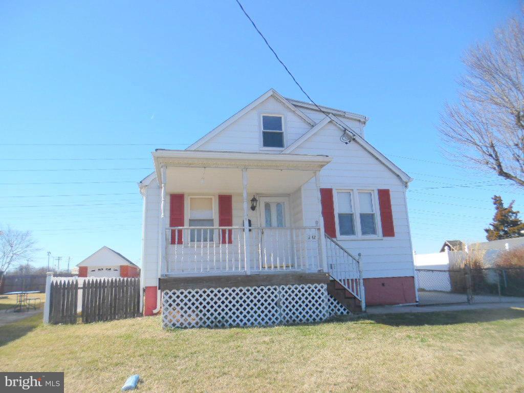 2422 Plainfield Road Dundalk, MD 21222 - Photo 1 of 14 a front view of a house with a yard