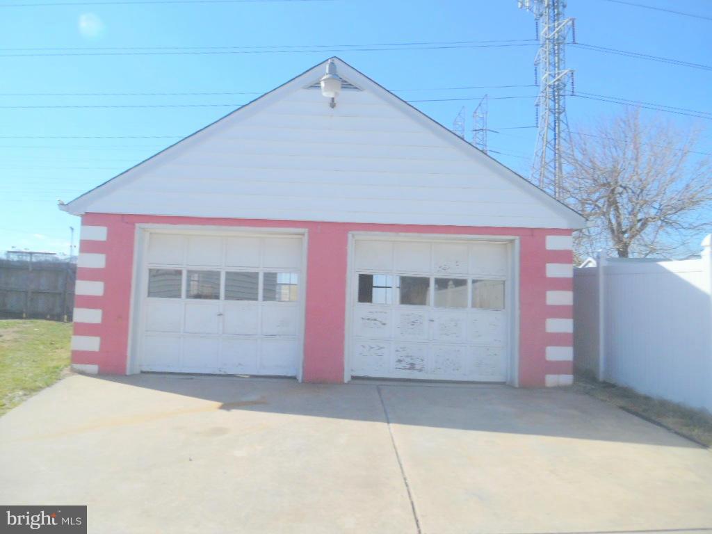 2422 Plainfield Road Dundalk, MD 21222 - Photo 4 of 14 a front view of a house with a garage
