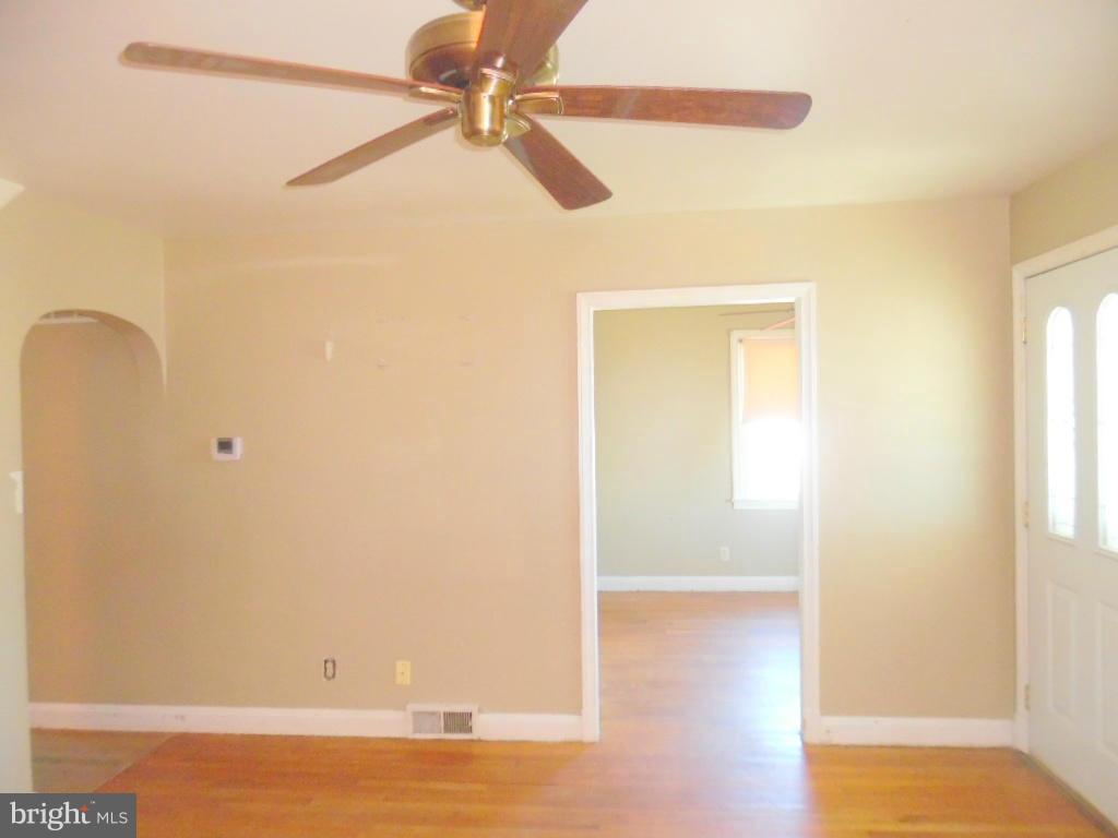 2422 Plainfield Road Dundalk, MD 21222 - Photo 7 of 14 a view of room with window and wooden floor