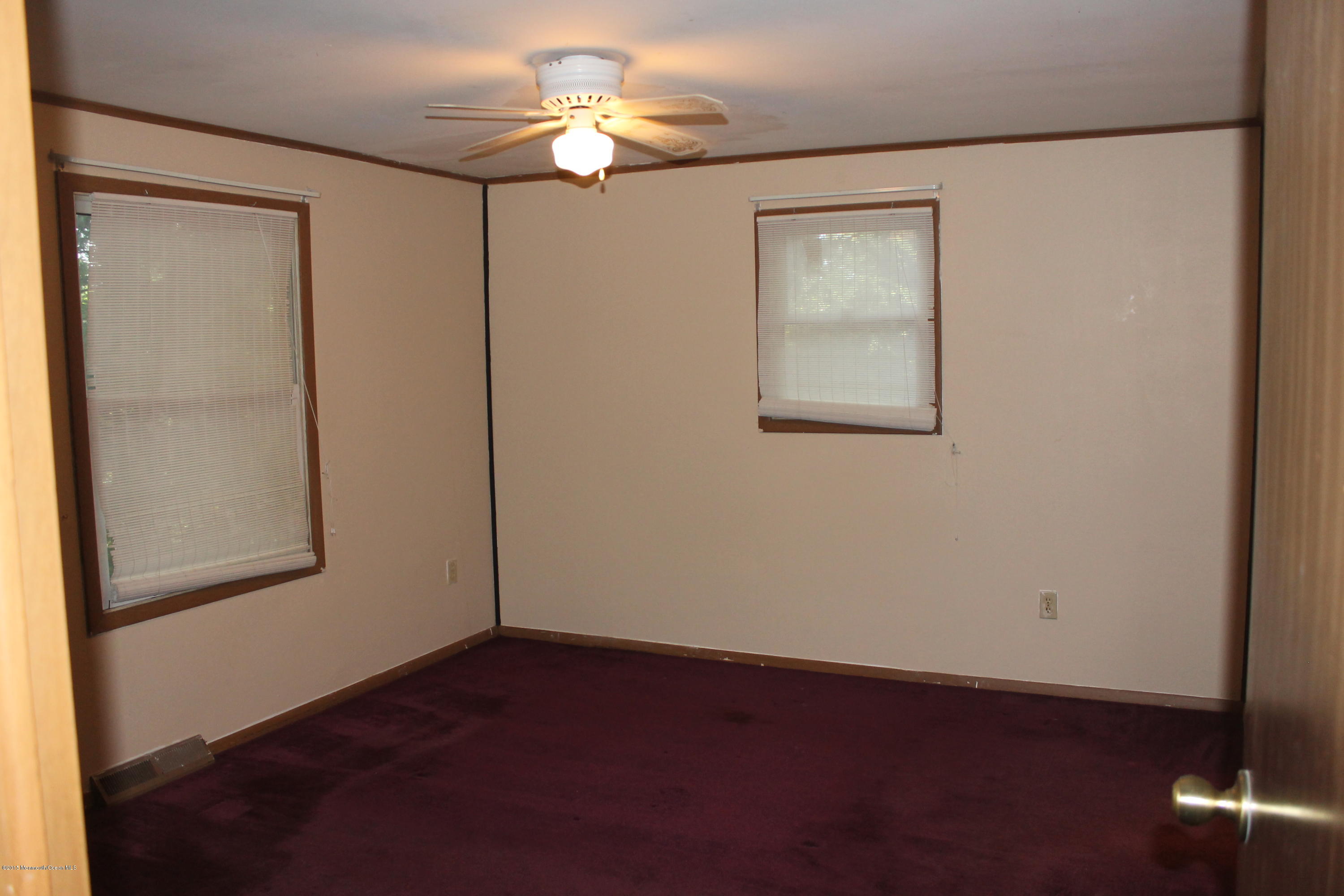 185 Cedar Swamp Road Jackson, NJ 08527 - Photo 12 of 36 an empty room with windows and fan