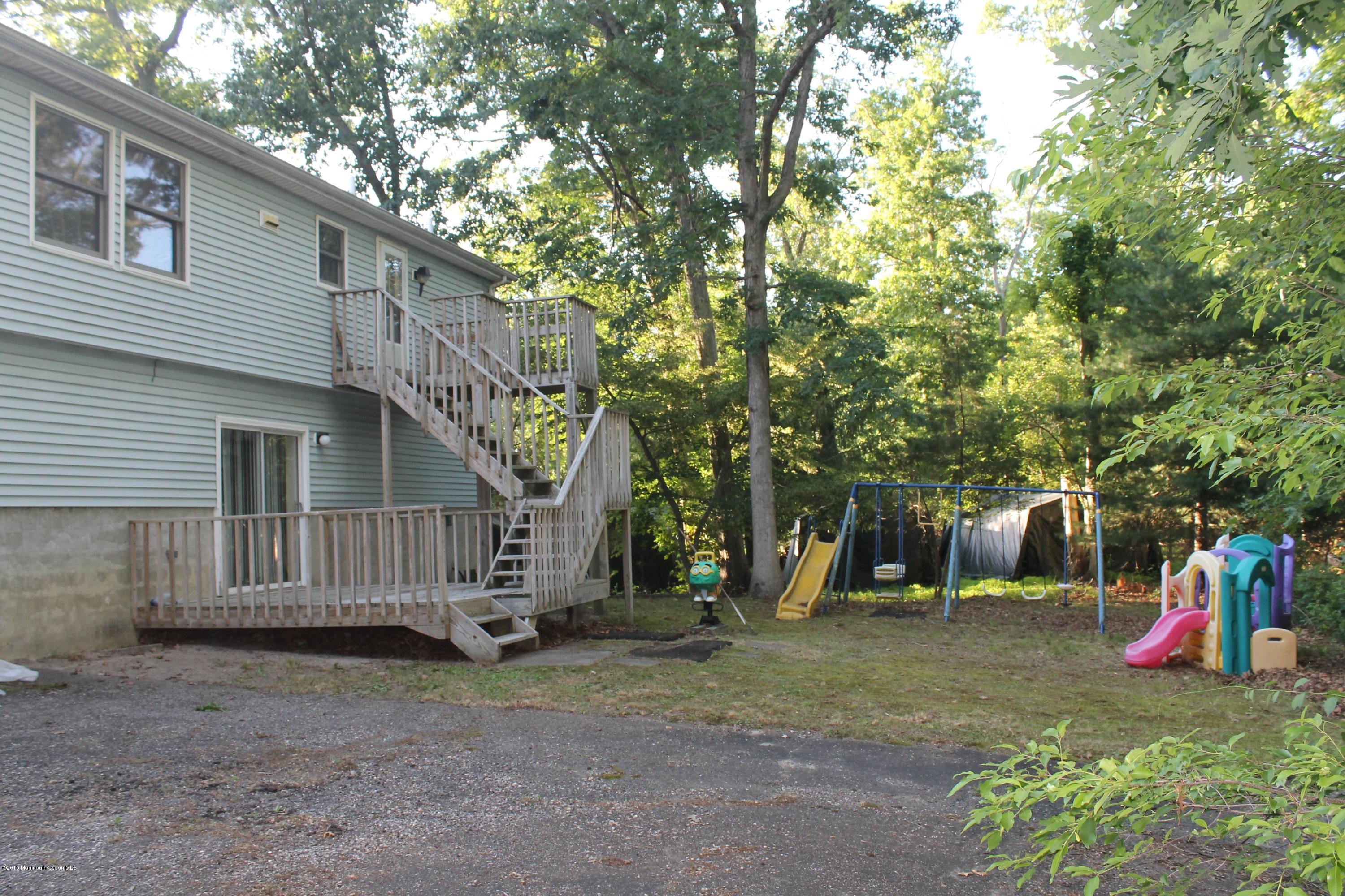 185 Cedar Swamp Road Jackson, NJ 08527 - Photo 21 of 36 a view of a house with a yard and a large tree
