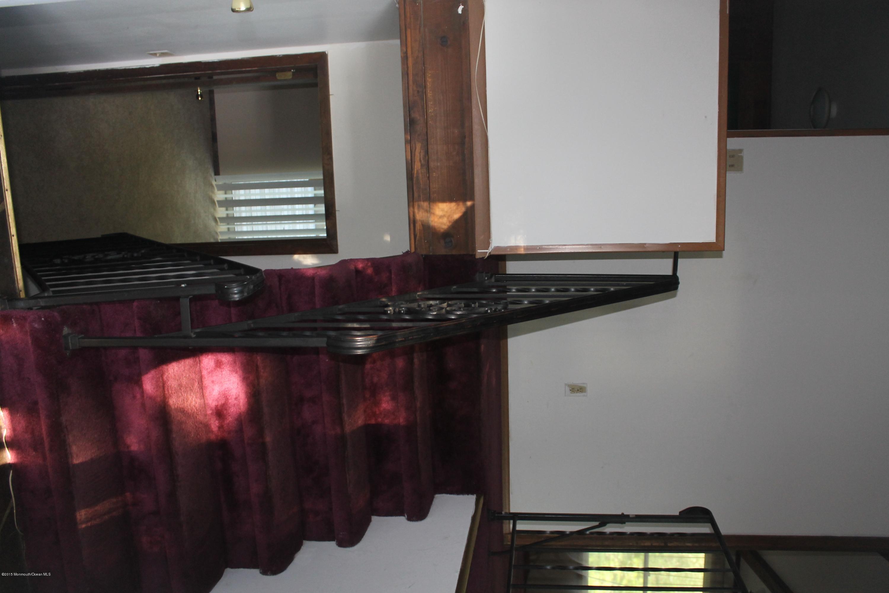 185 Cedar Swamp Road Jackson, NJ 08527 - Photo 23 of 36 a bathroom with a light fixture and a sink