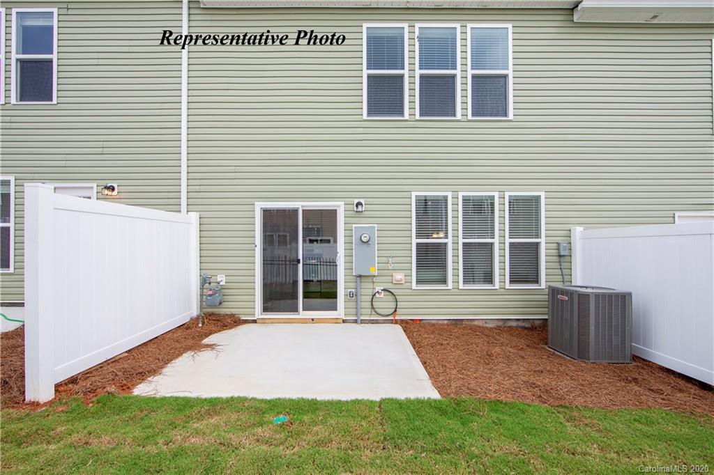 741 Elders Story Road, Unit 352 Fort Mill, SC 29708 - Photo 13 of 17 a front view of a house with a yard and garage